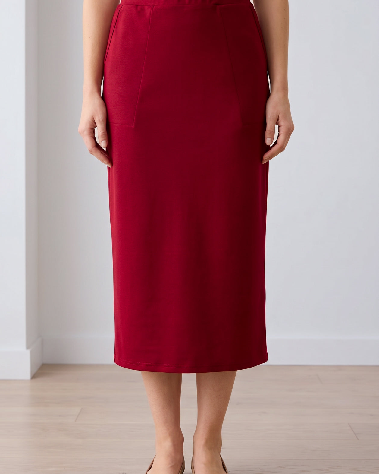 Model wearing Nuggles® 31" Pocket Classic Skirt in Dark Brick