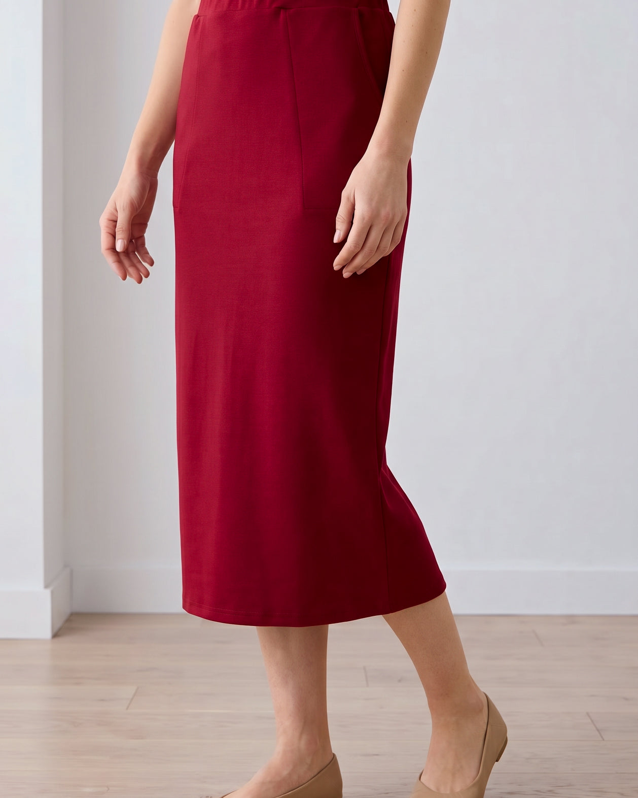 Model wearing Nuggles® 31" Pocket Classic Skirt in Dark Brick