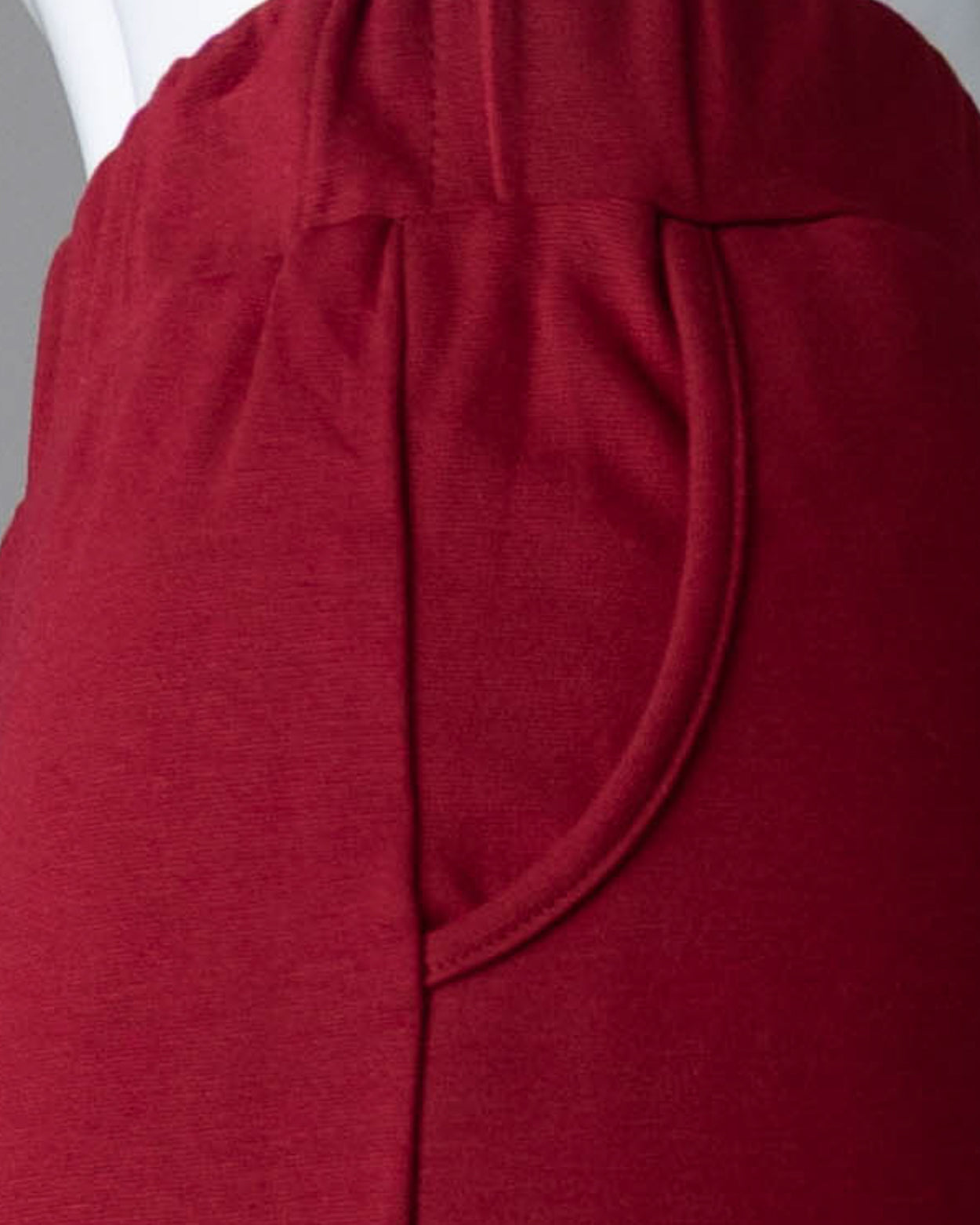 Model wearing Nuggles® 31" Pocket Classic Skirt in Dark Brick