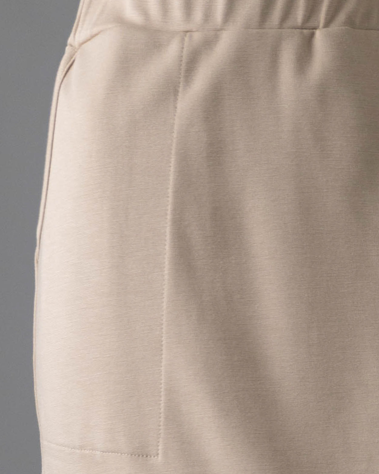 Model wearing Nuggles® 31" Pocket Classic Skirt in Khaki