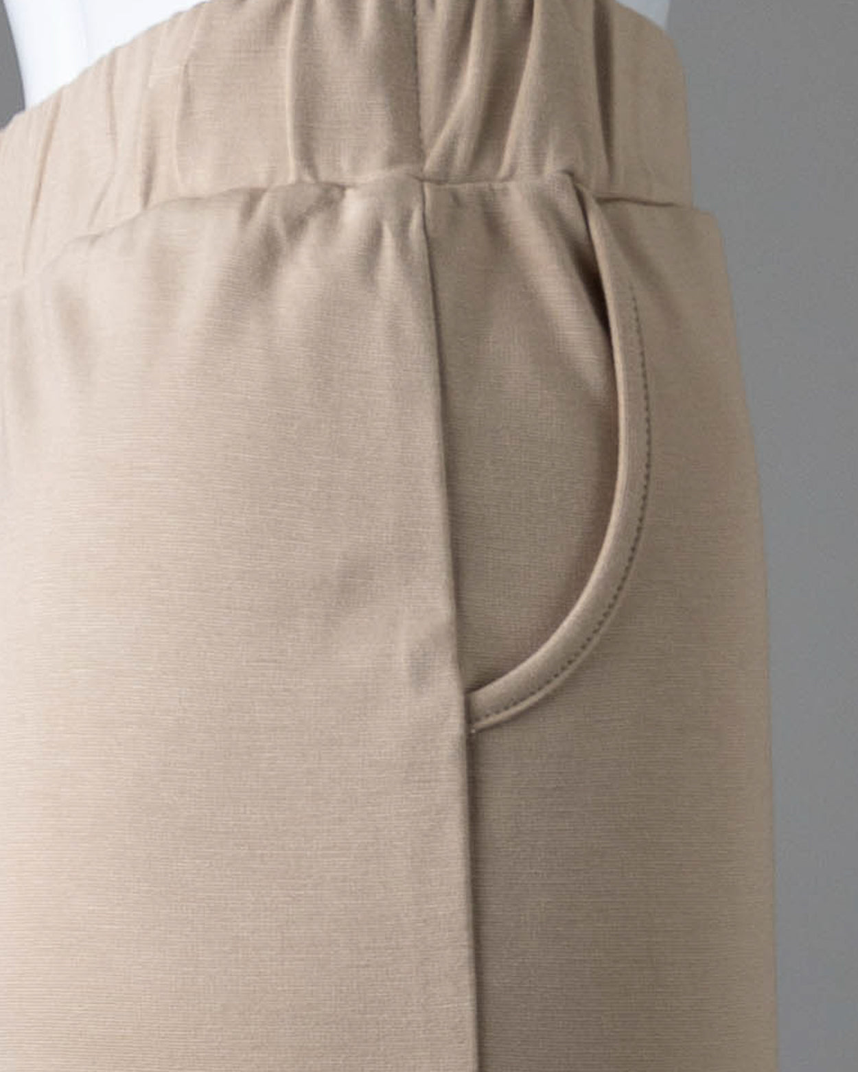 Model wearing Nuggles® 31" Pocket Classic Skirt in Khaki