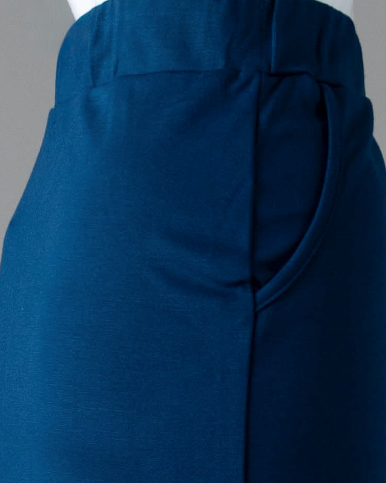 Model wearing Nuggles® 31" Pocket Classic Skirt in Peacock Blue