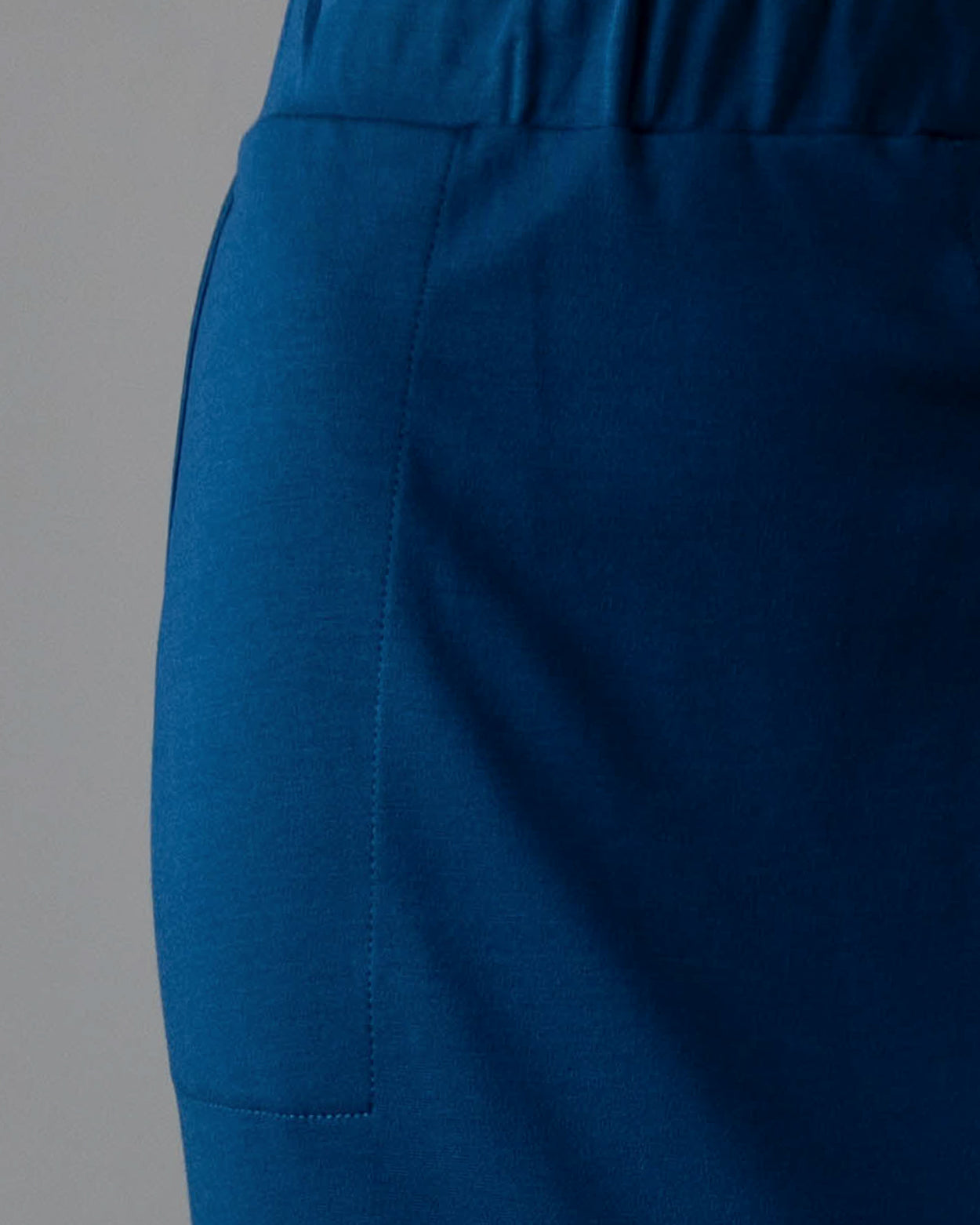 Model wearing Nuggles® 31" Pocket Classic Skirt in Peacock Blue