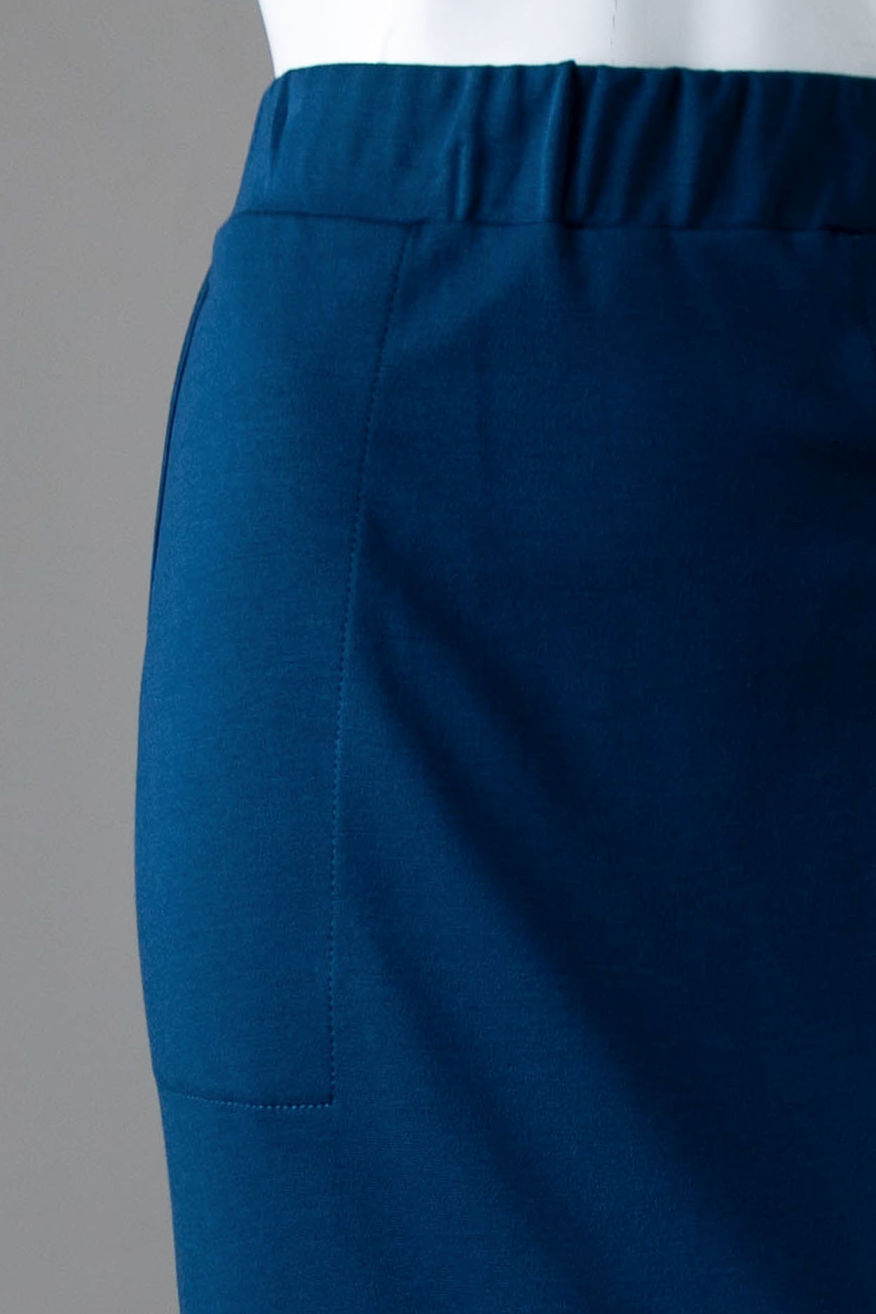 Model wearing Nuggles® 31" Pocket Classic Skirt in Peacock Blue