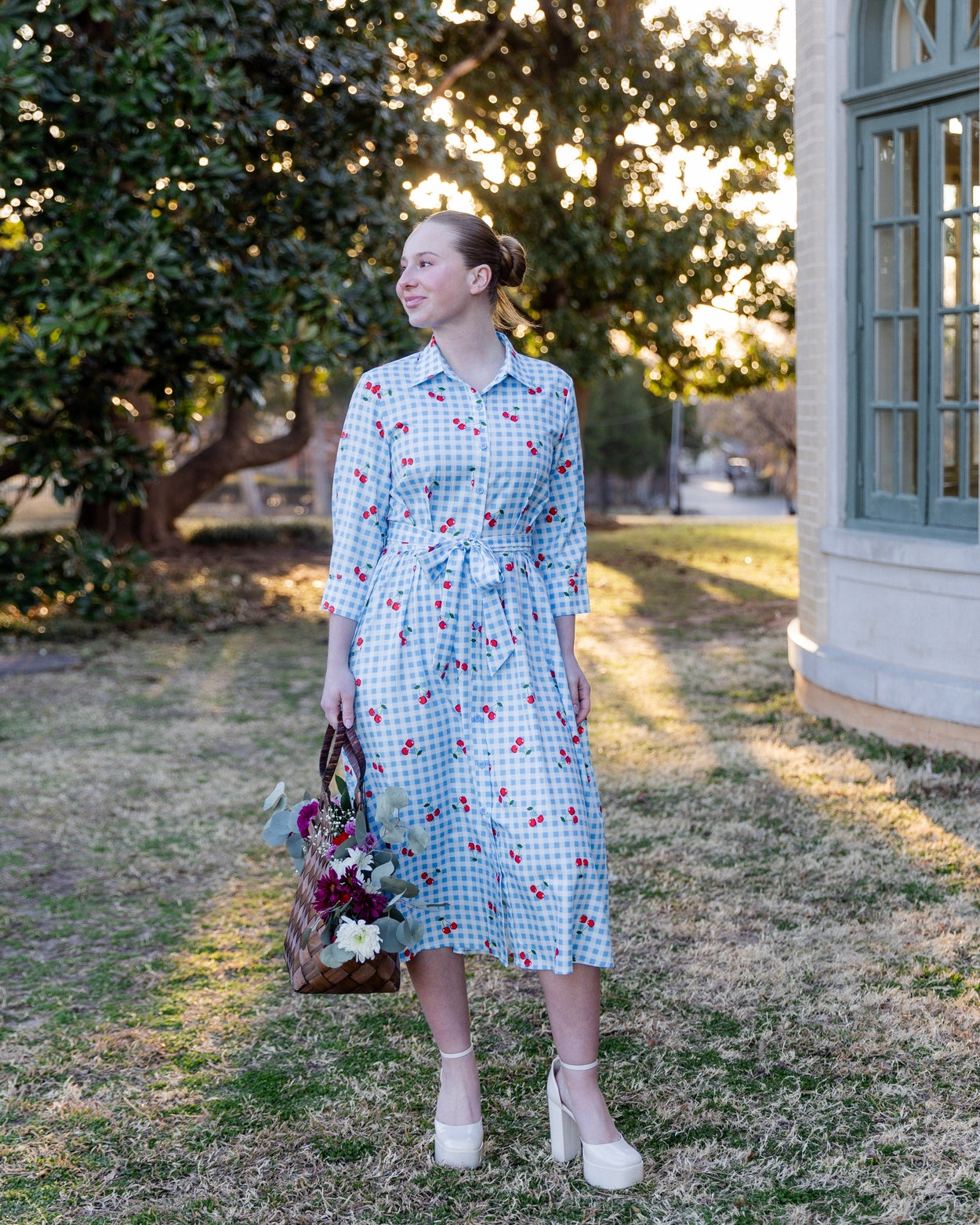 Model wearing the Nuggles® Rachel Dress in Sweet Cherry Check