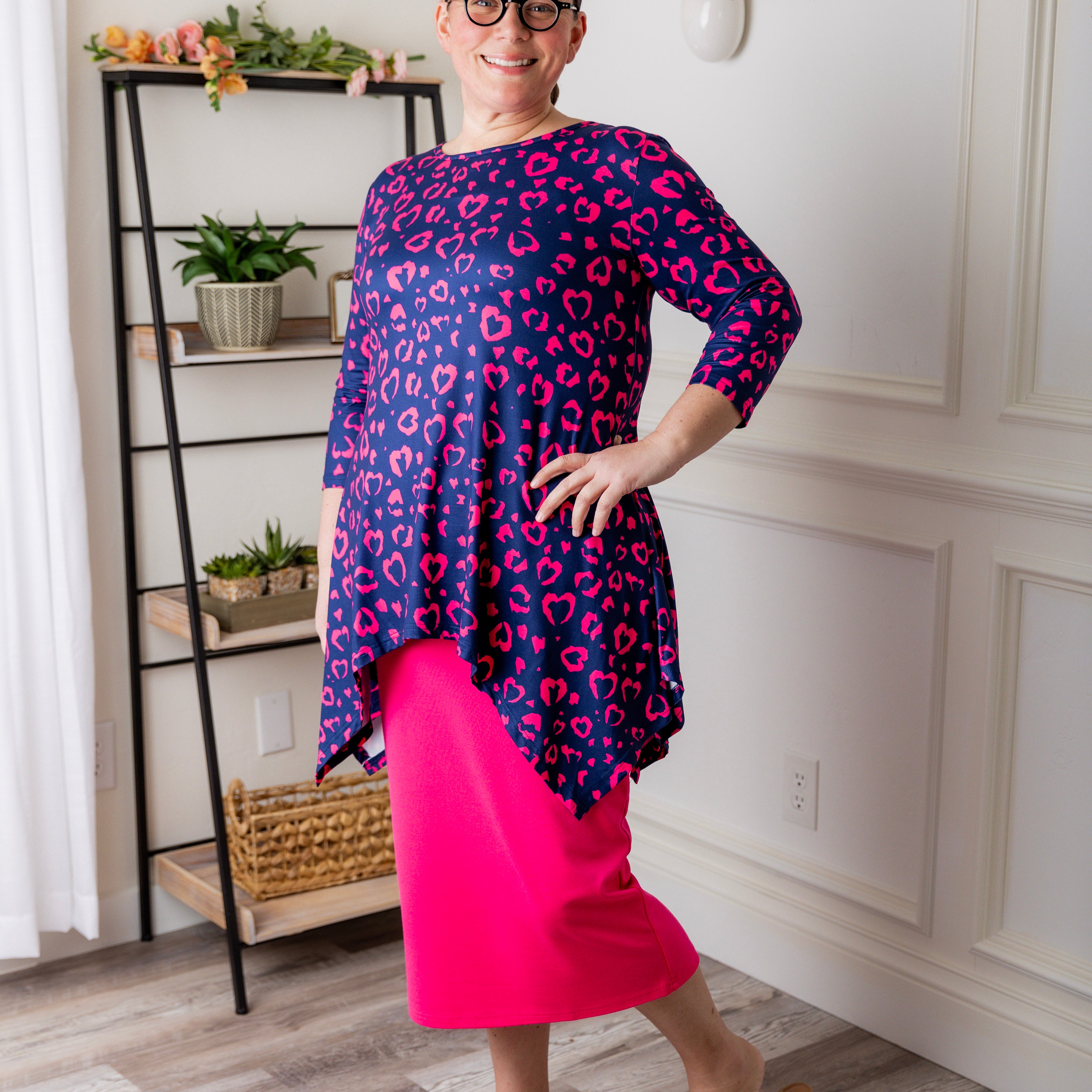 Woman wearing the Sheyanne Top by Nuggles® – modest 3/4-sleeve top with pockets, soft Tiff fabric, styled with a classic skirt for a comfortable and elegant look.