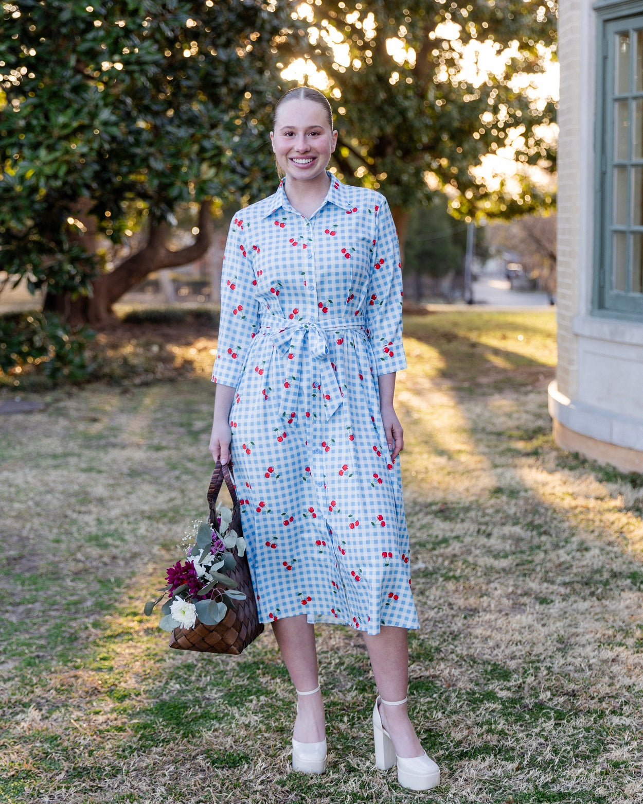 Model wearing the Nuggles® Rachel Dress in Sweet Cherry Check