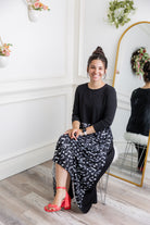 Model modeling Nuggles® Charay Dress with ¾ sleeves and high-low hem. Modest and stylish A-line dress with flattering fit.