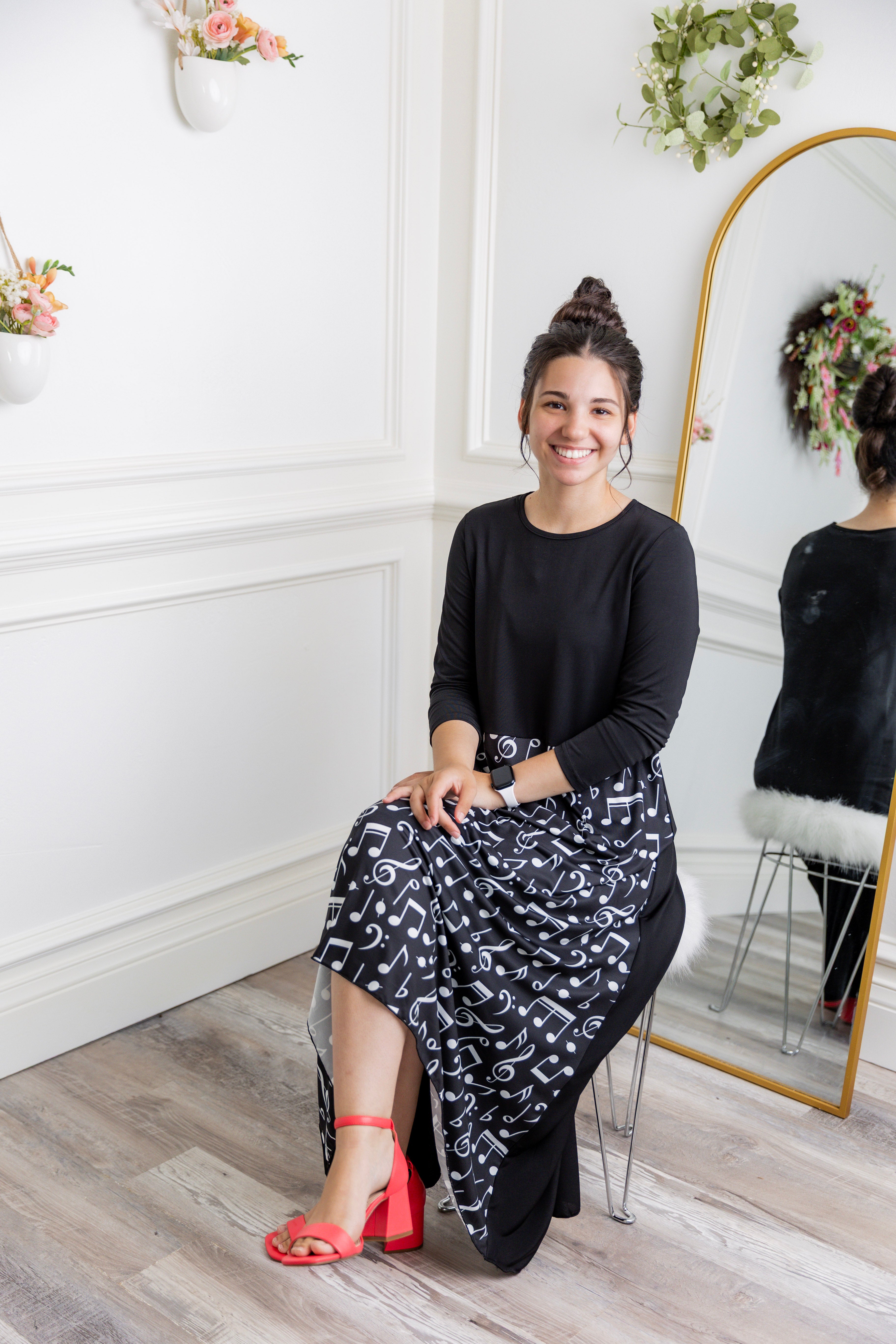 Model modeling Nuggles® Charay Dress with ¾ sleeves and high-low hem. Modest and stylish A-line dress with flattering fit.