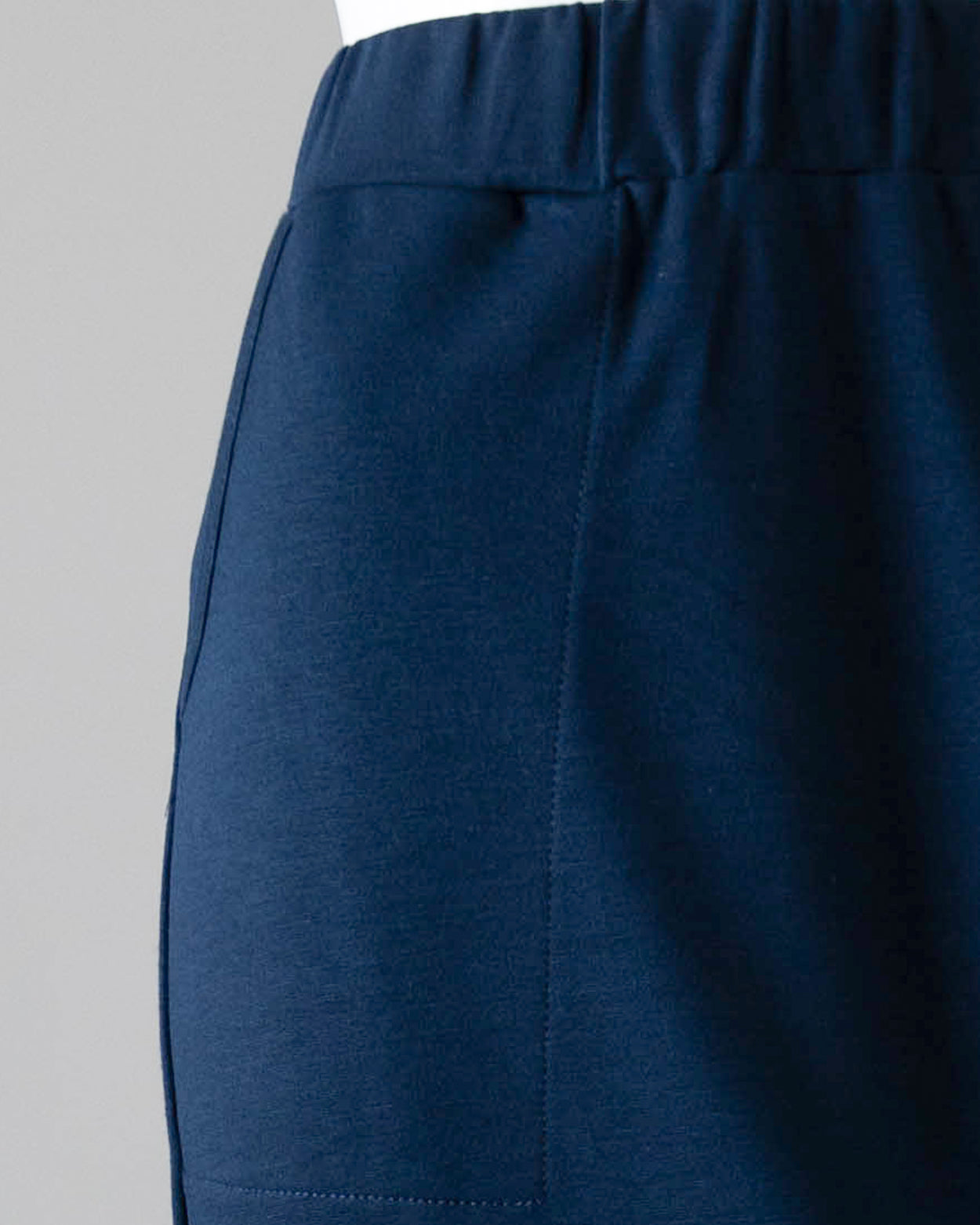 Model wearing Nuggles® 34" Pocket Classic Skirt in Dark Navy
