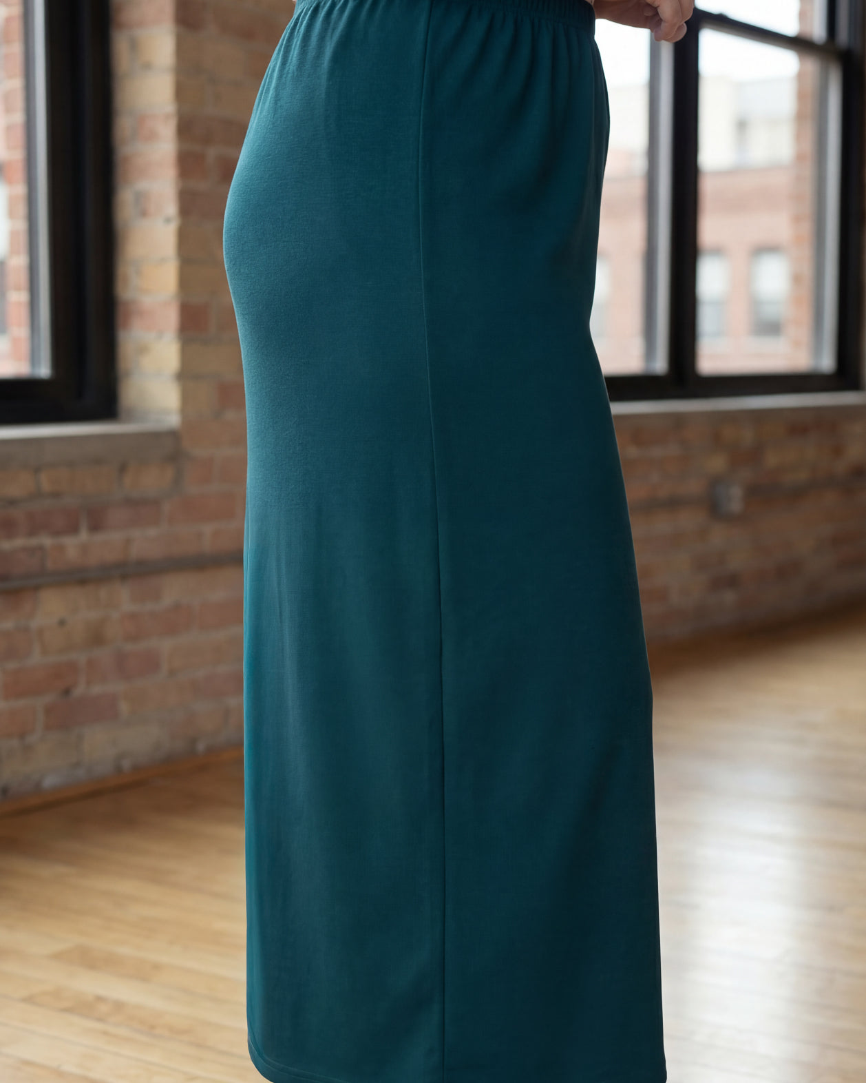 Model wearing Nuggles® 34" Classic Skirt in Teal Green