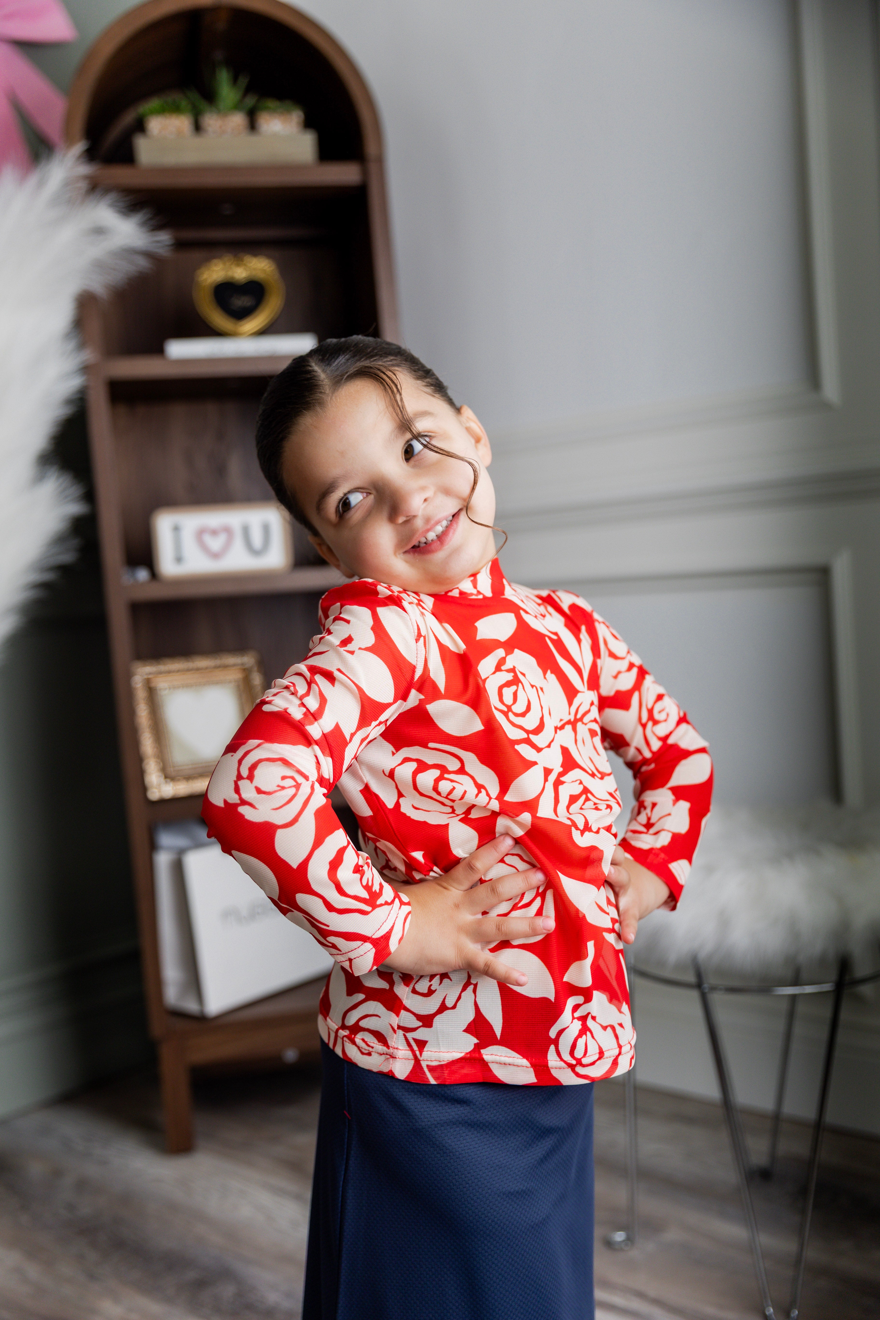 Model wearing Nuggles® Girls' Mesh Tee in Rosie Rouge