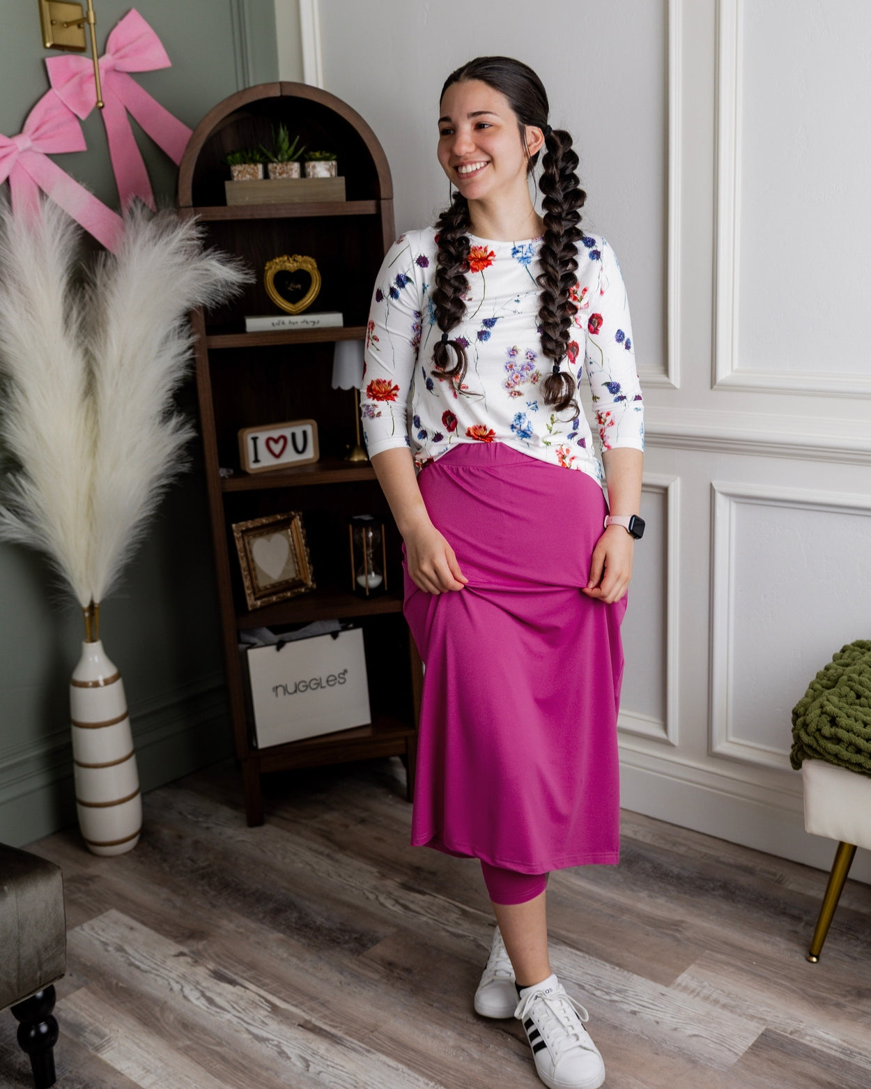 Model wearing Nuggles® 31" All-Sport Skirt in Hot Pink