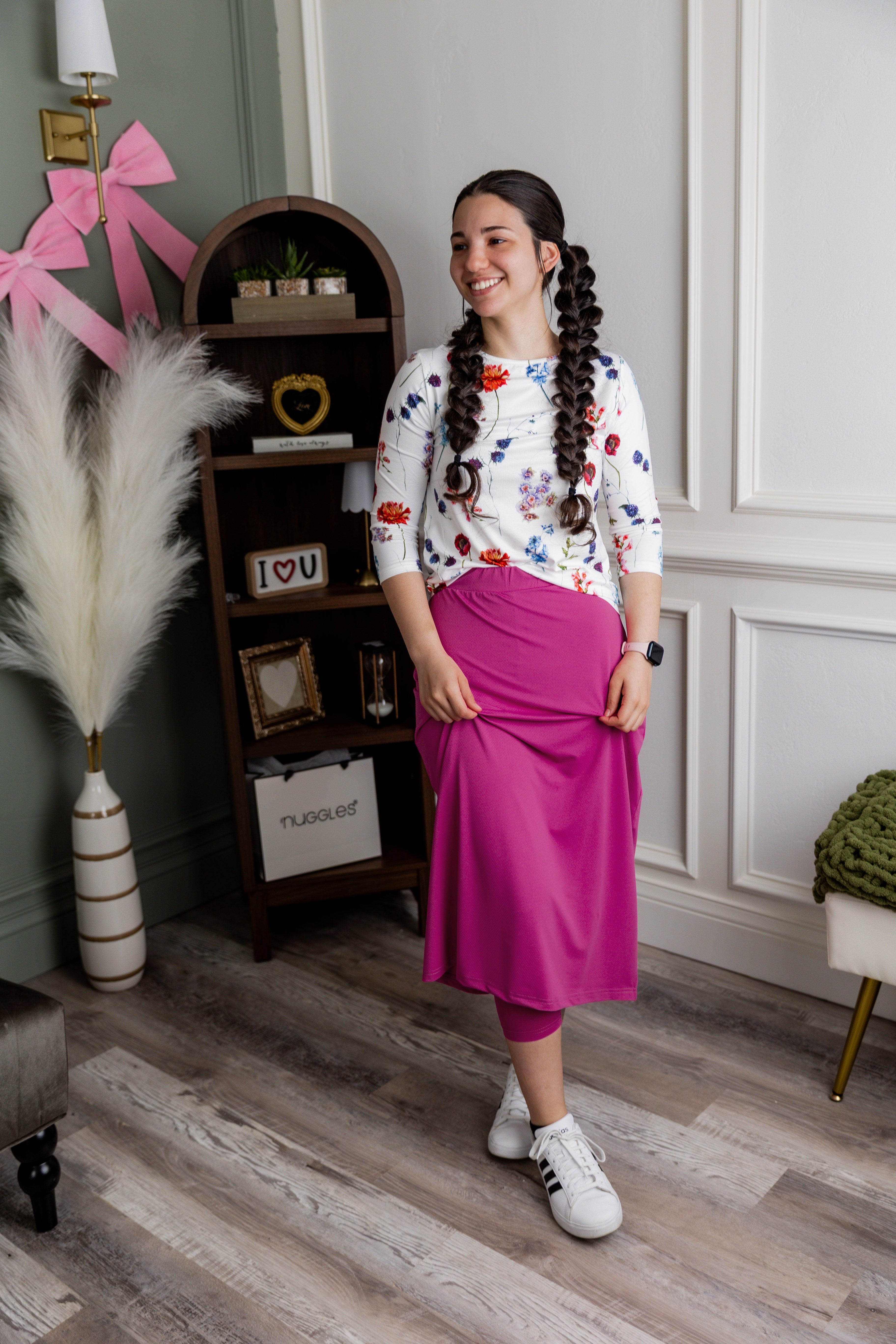 Model wearing Nuggles® 31" All-Sport Skirt in Hot Pink