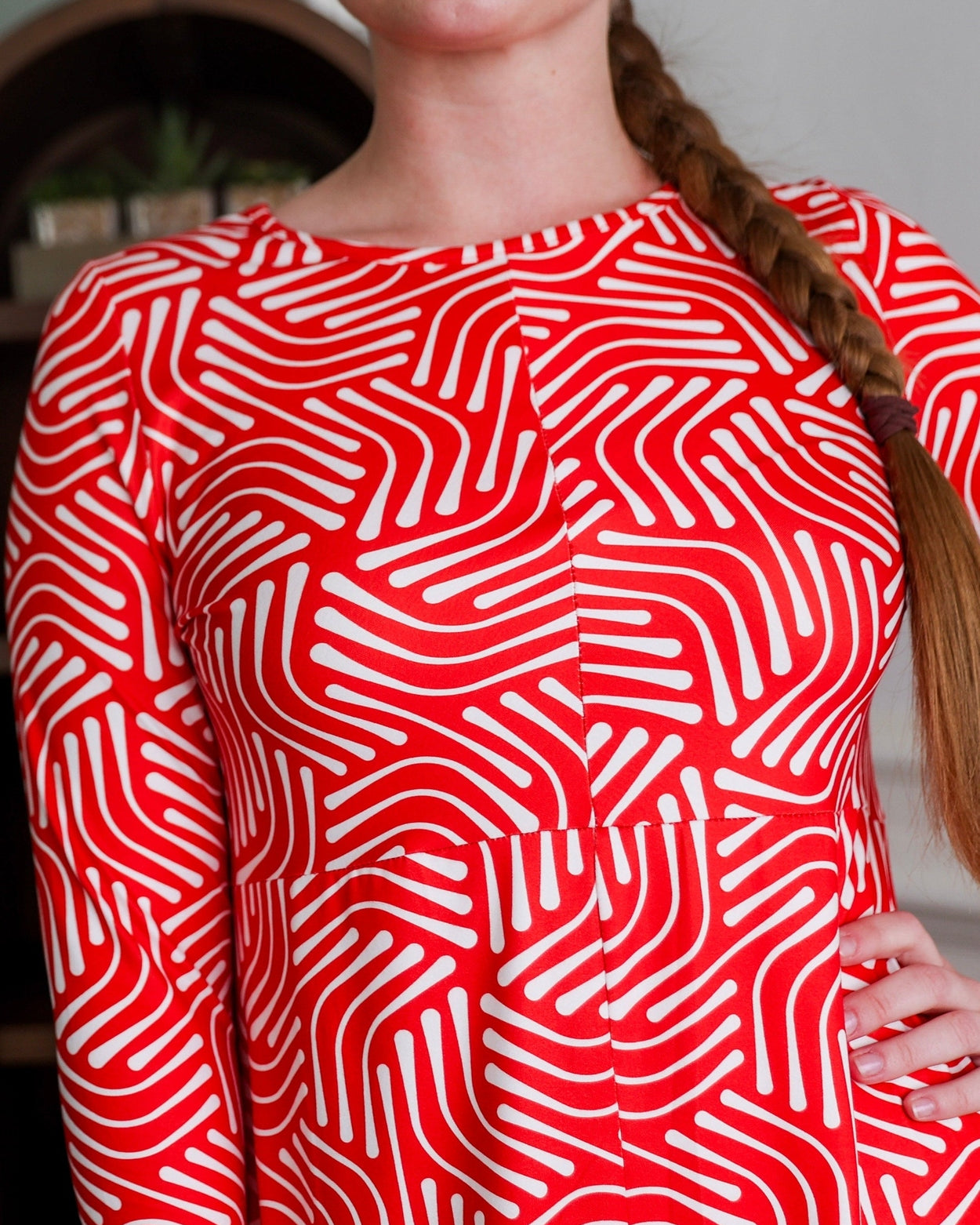 Model wearing Modest Nuggles® Cindy Bubble Dress in Berry Maze