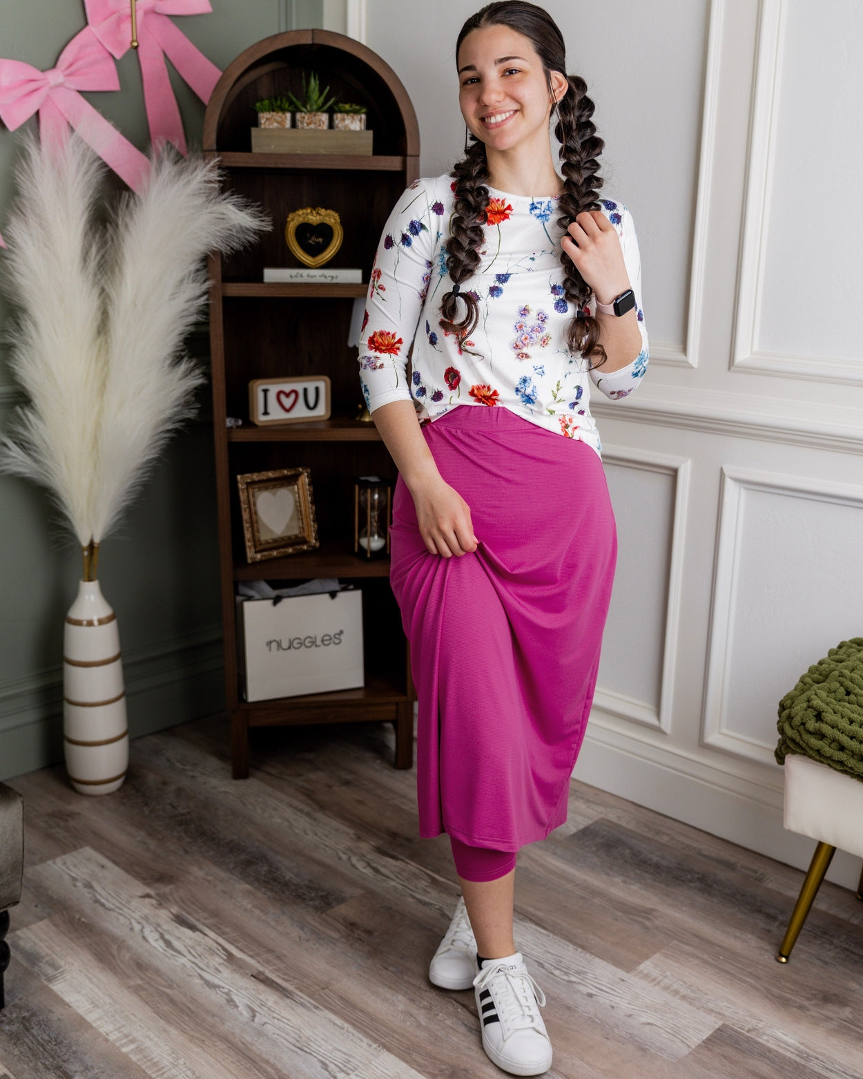 Model wearing Nuggles® 31" All-Sport Skirt in Hot Pink