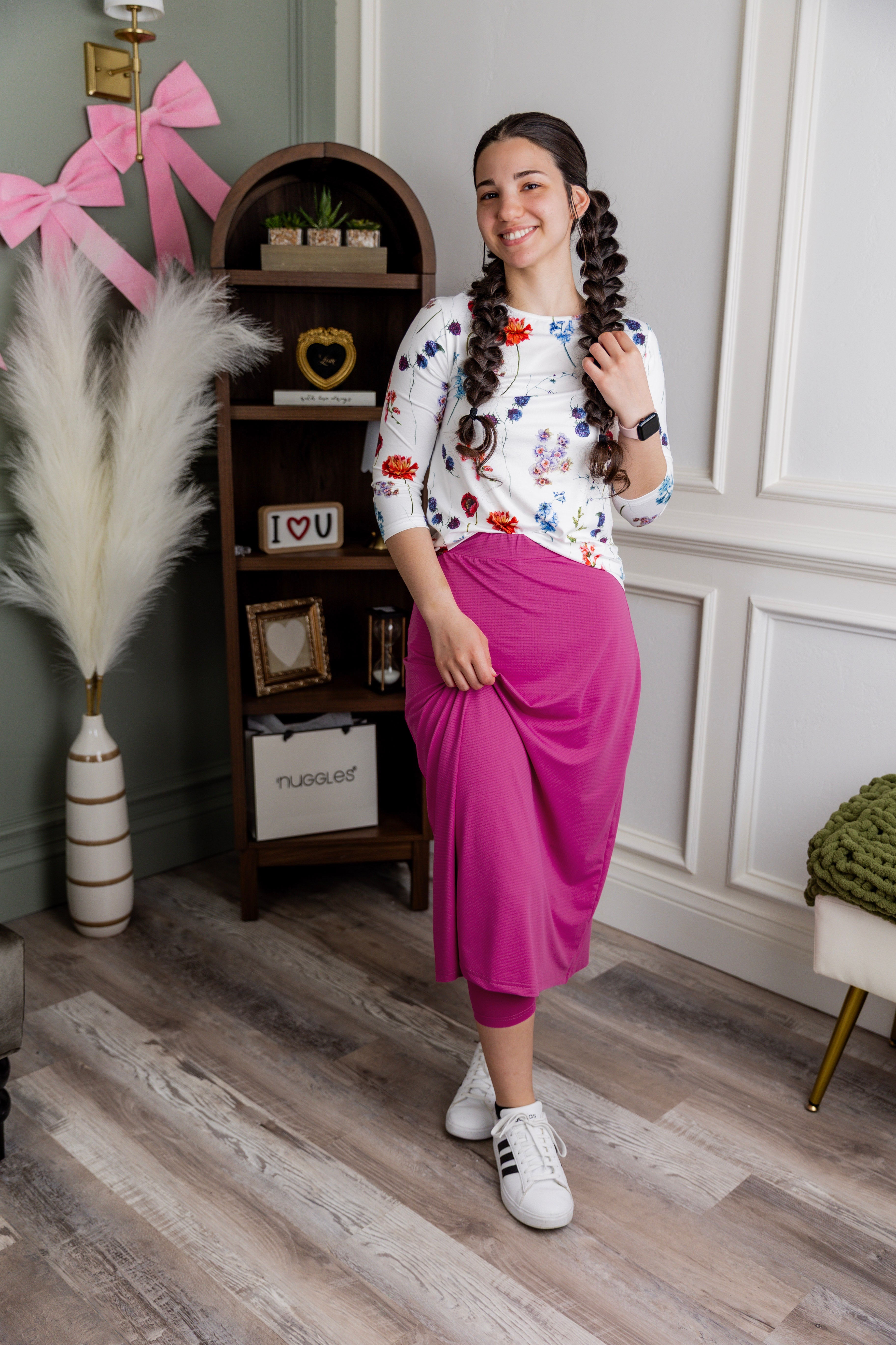 Model wearing Nuggles® 31" All-Sport Skirt in Hot Pink