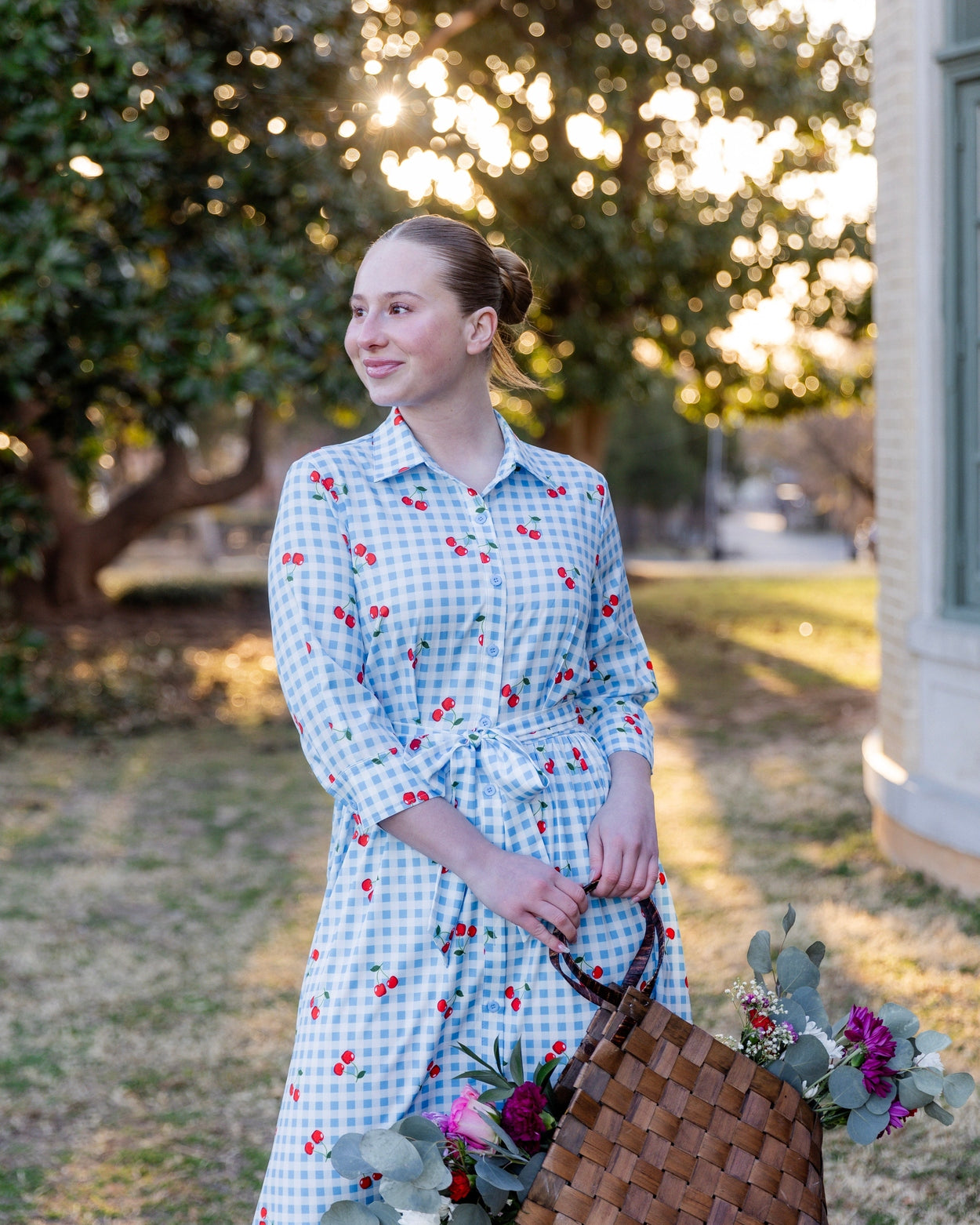 Model wearing the Nuggles® Rachel Dress in Sweet Cherry Check