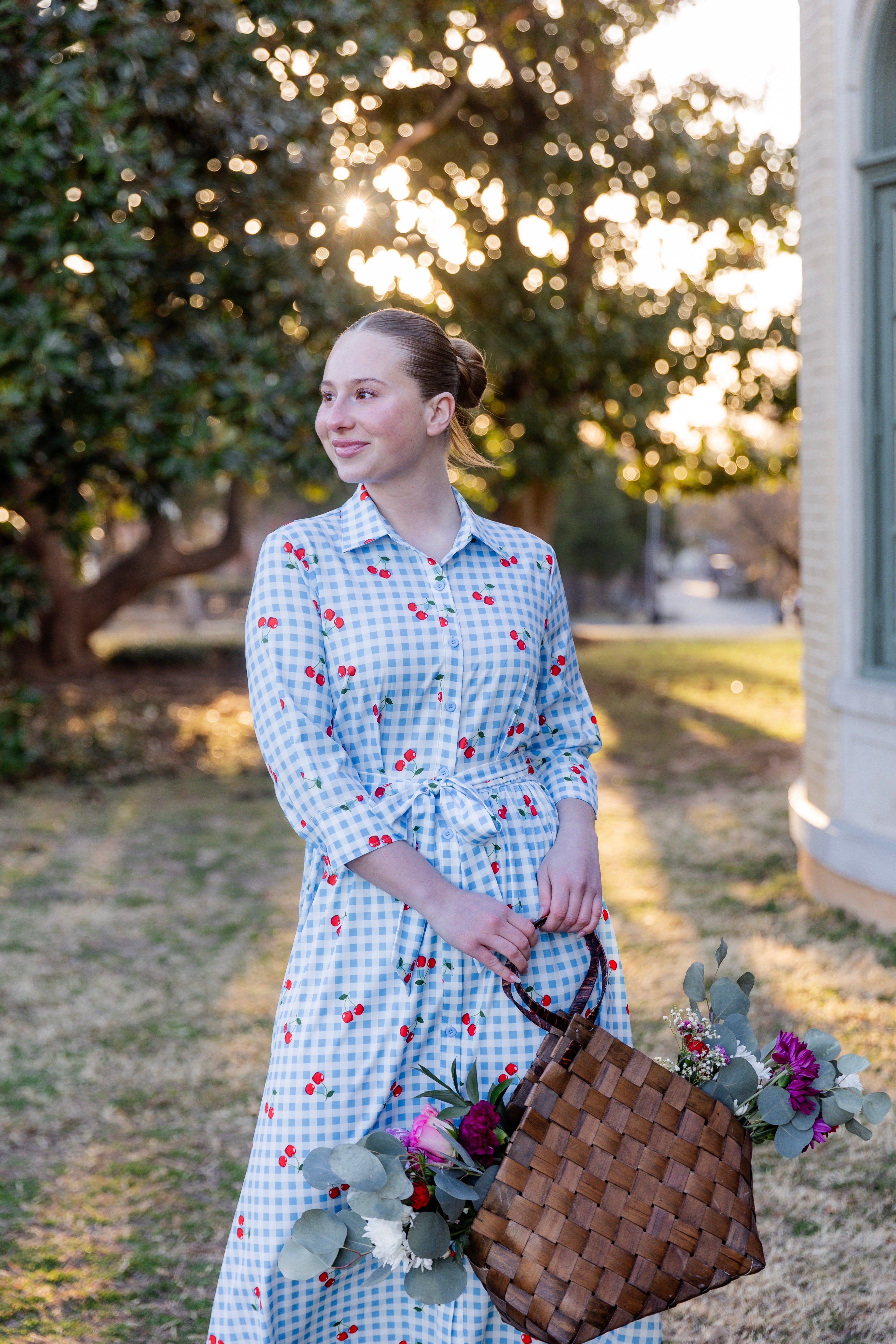 Model wearing the Nuggles® Rachel Dress in Sweet Cherry Check