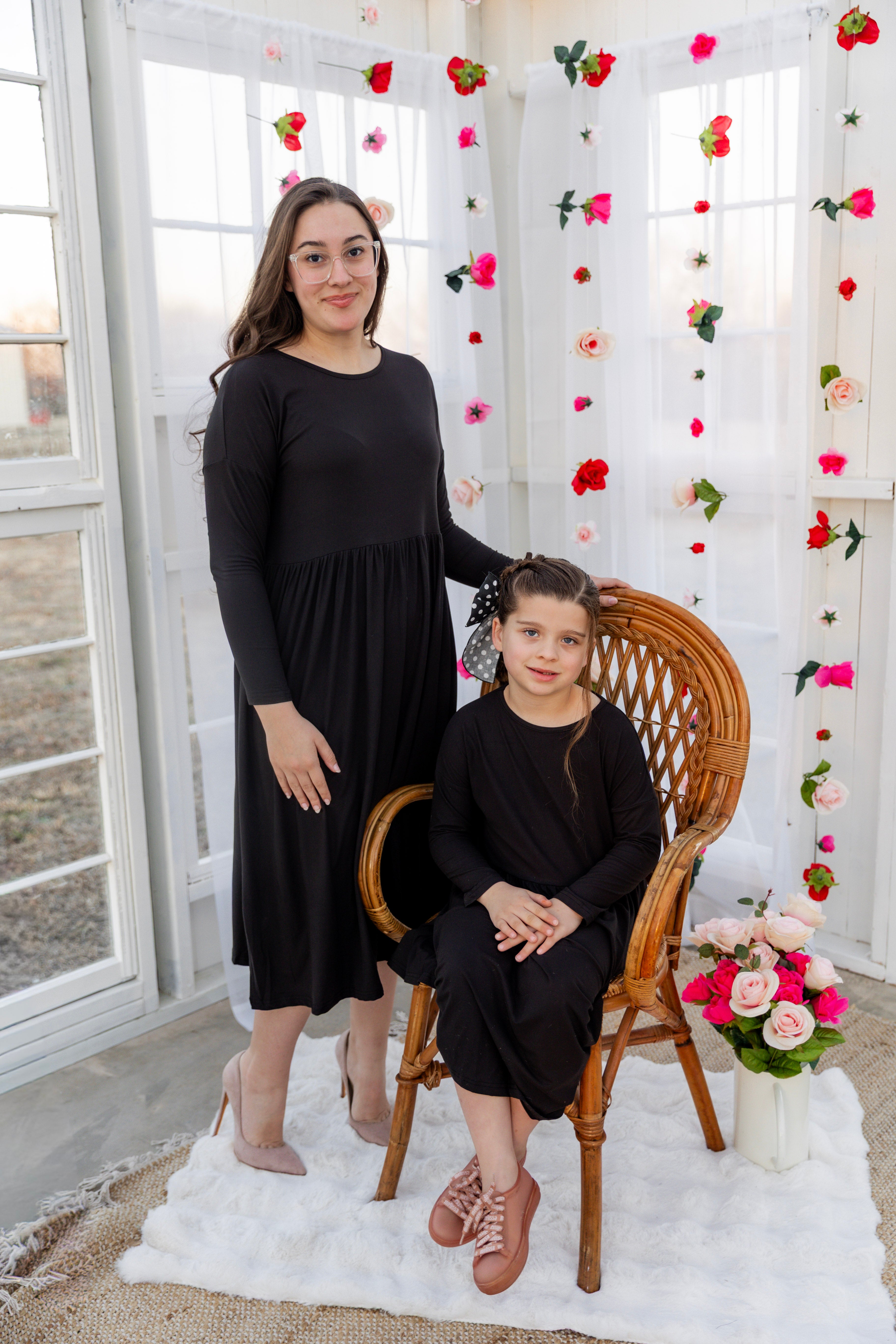 Model wearing the Nuggles® Farah Dress in Black