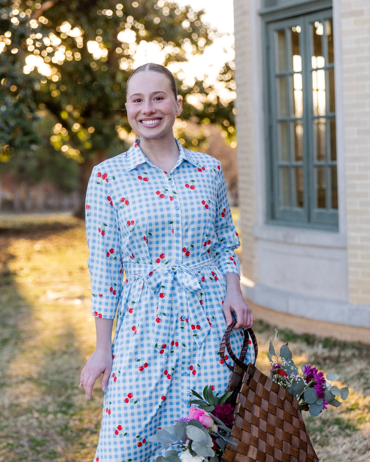 Model wearing the Nuggles® Rachel Dress in Sweet Cherry Check