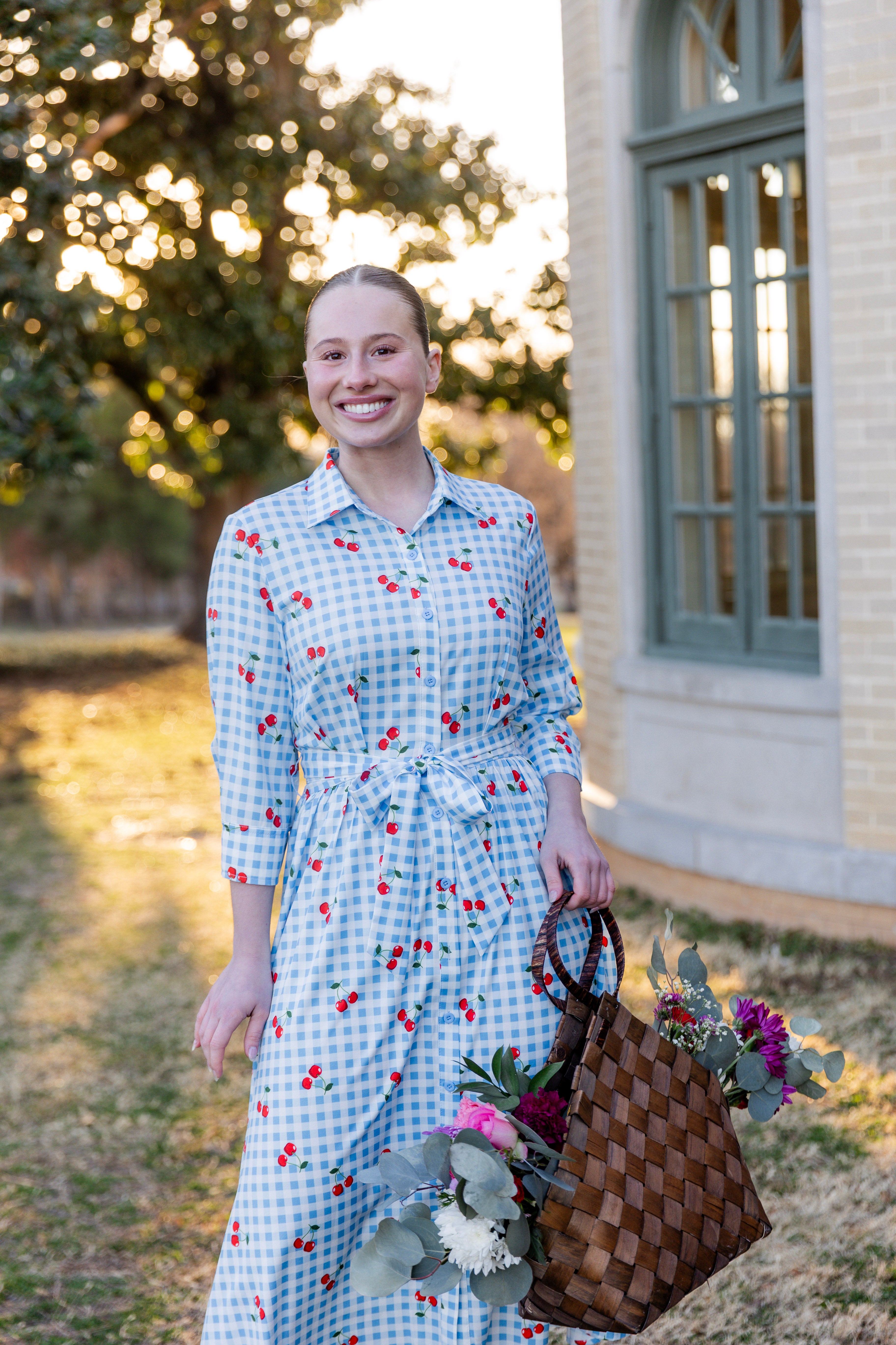Model wearing the Nuggles® Rachel Dress in Sweet Cherry Check