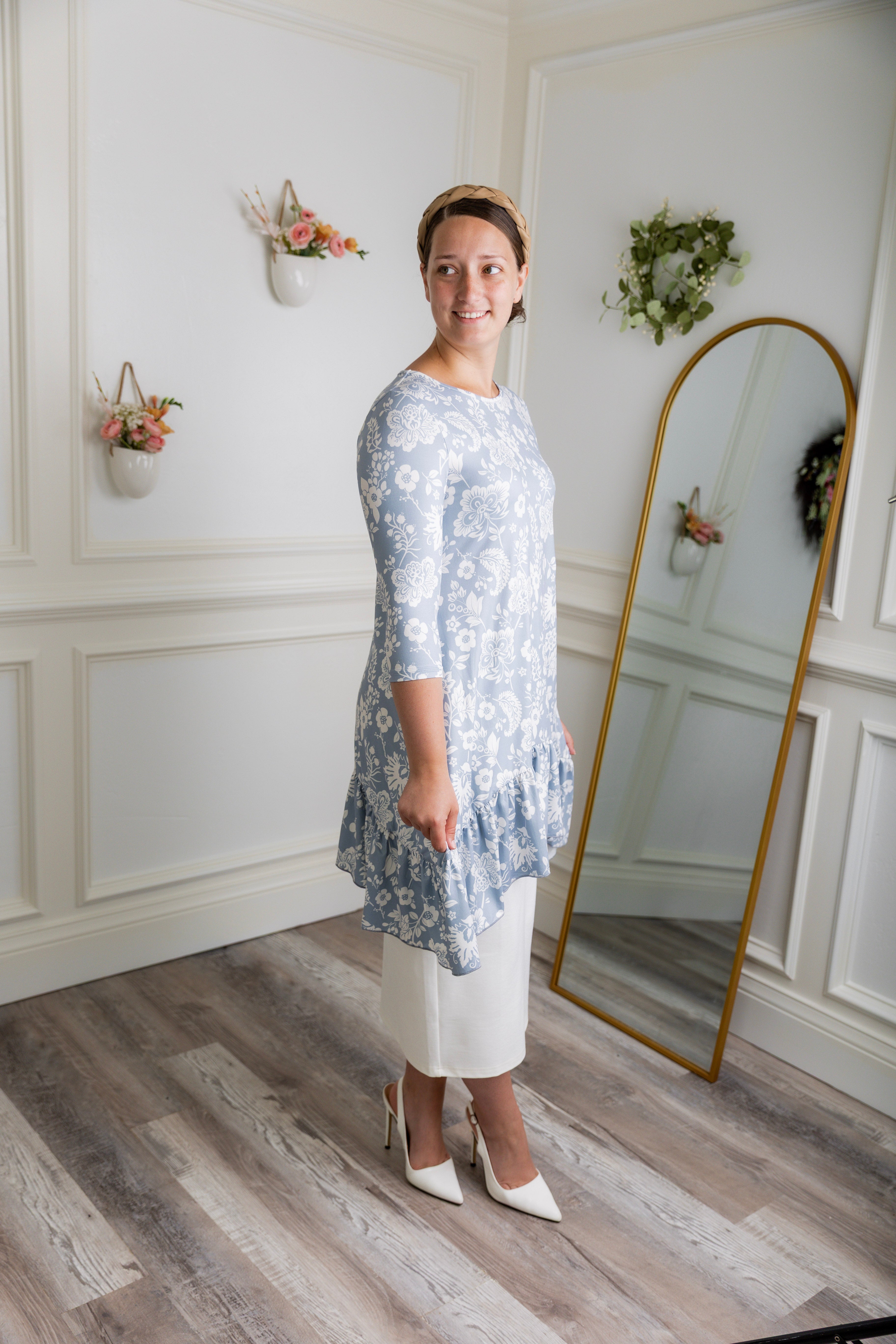 Modest light blue floral print tunic for women – Nuggles® Rose Top with high-low ruffle hem and 3/4 sleeves.