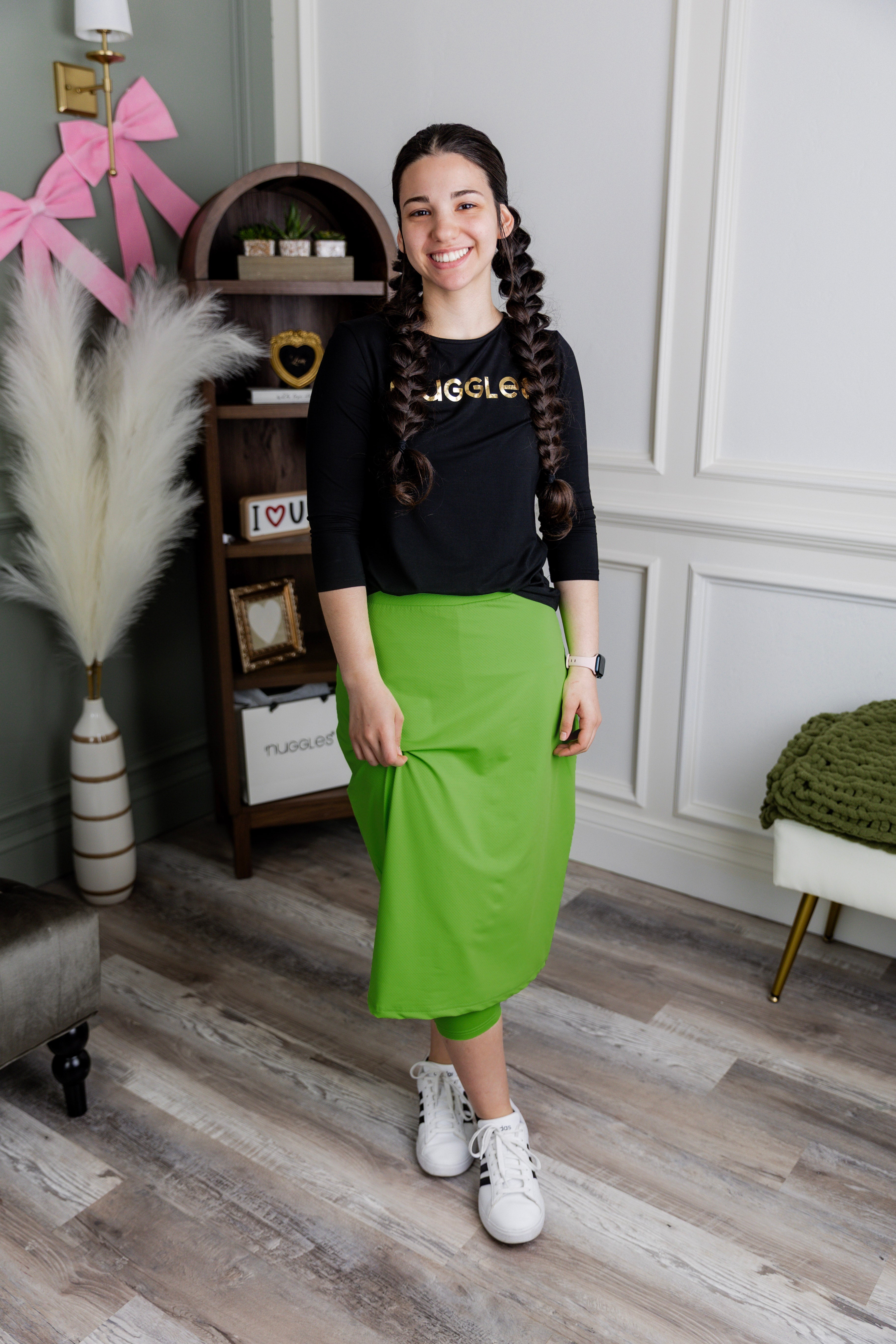 Model wearing Nuggles® 27" All-Sport Skirt in Green
