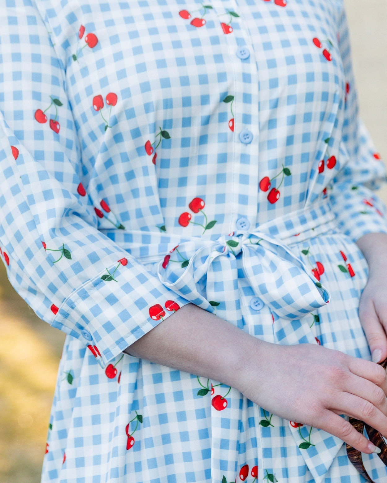 Model wearing the Nuggles® Rachel Dress in Sweet Cherry Check