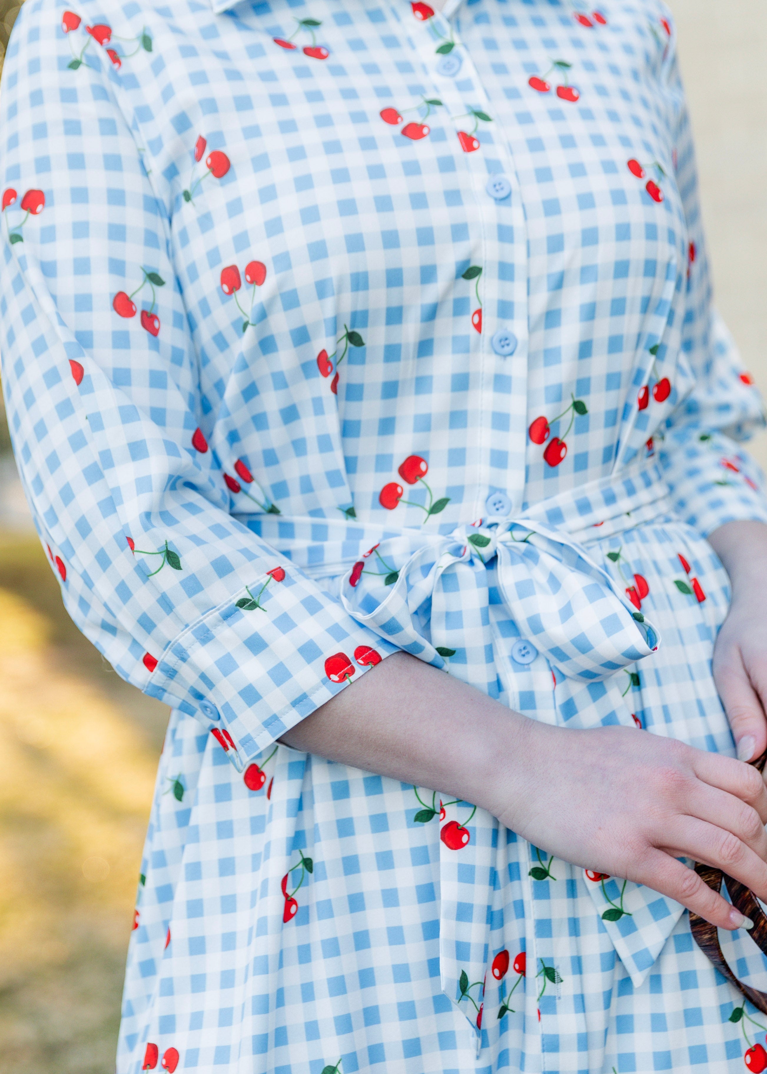 Model wearing the Nuggles® Rachel Dress in Sweet Cherry Check