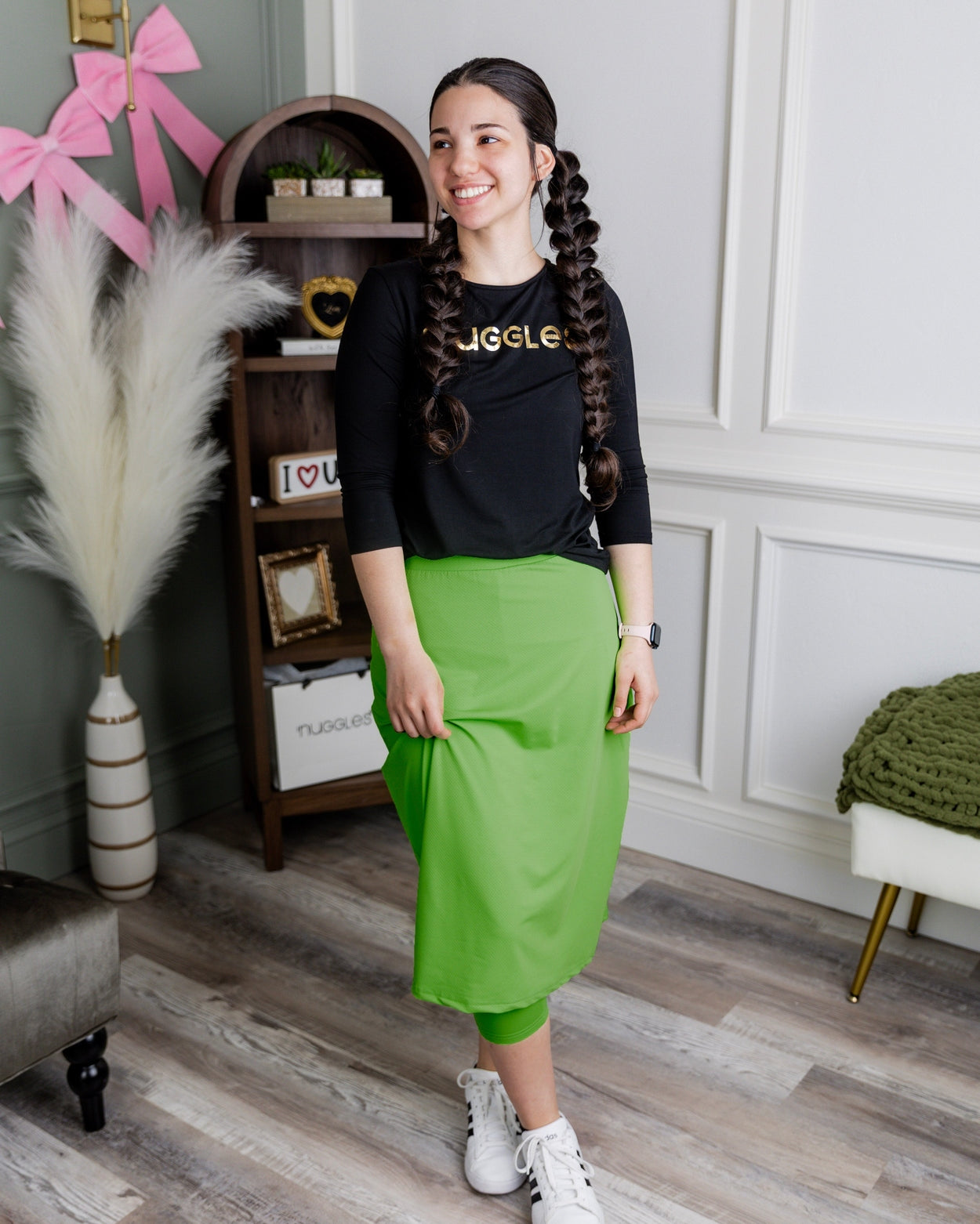 Model wearing Nuggles® 27" All-Sport Skirt in Green