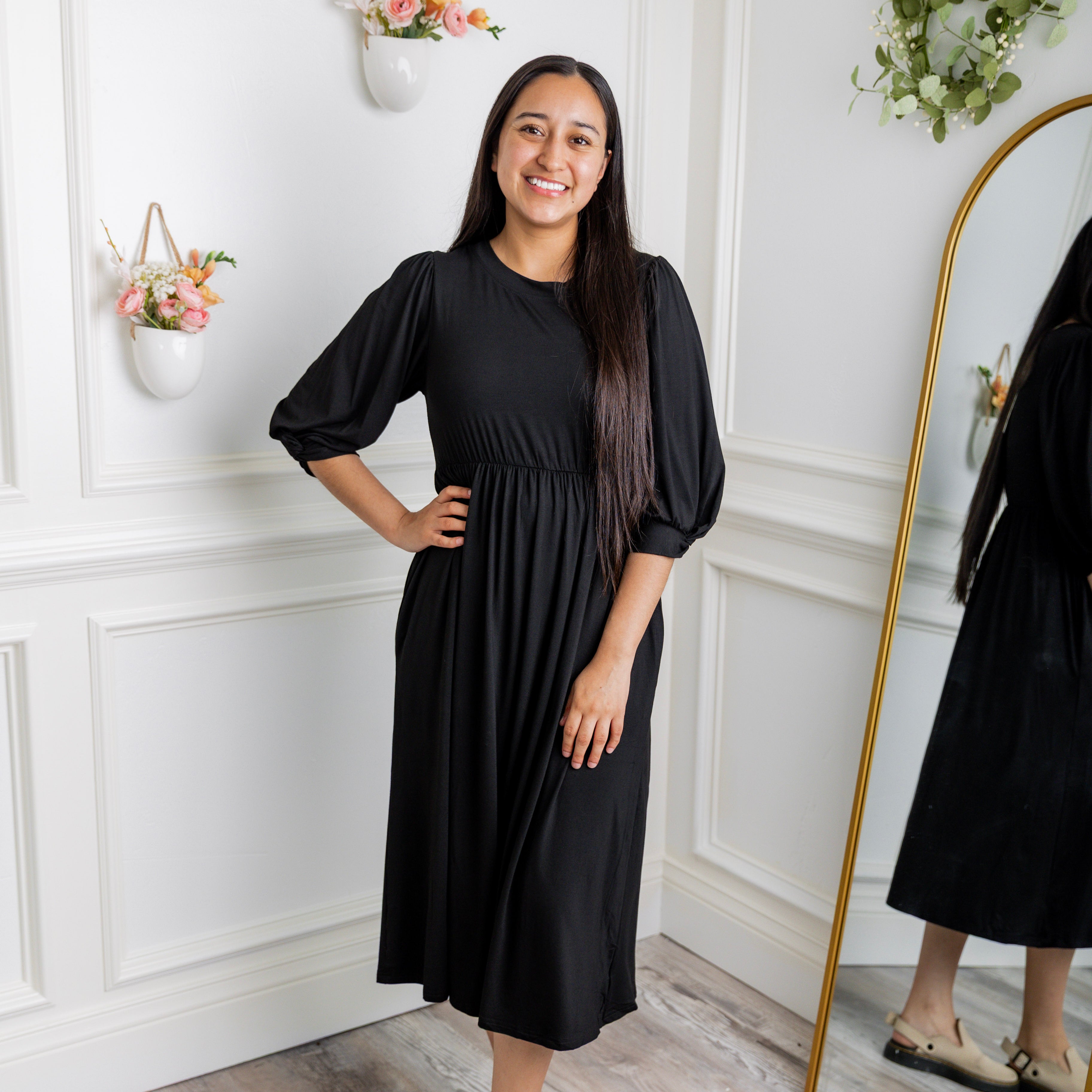 Modest Willow Solid Colors Dress by Nuggles® featuring a gathered waist, balloon sleeves, and side pockets; shown in various solid colors and angles for a stylish, comfortable everyday look.