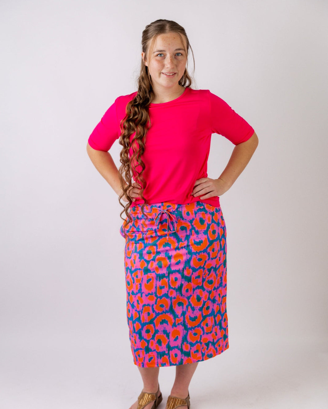 Model wearing the Nuggles® Essential Half Sleeve Tee in Hot Pink