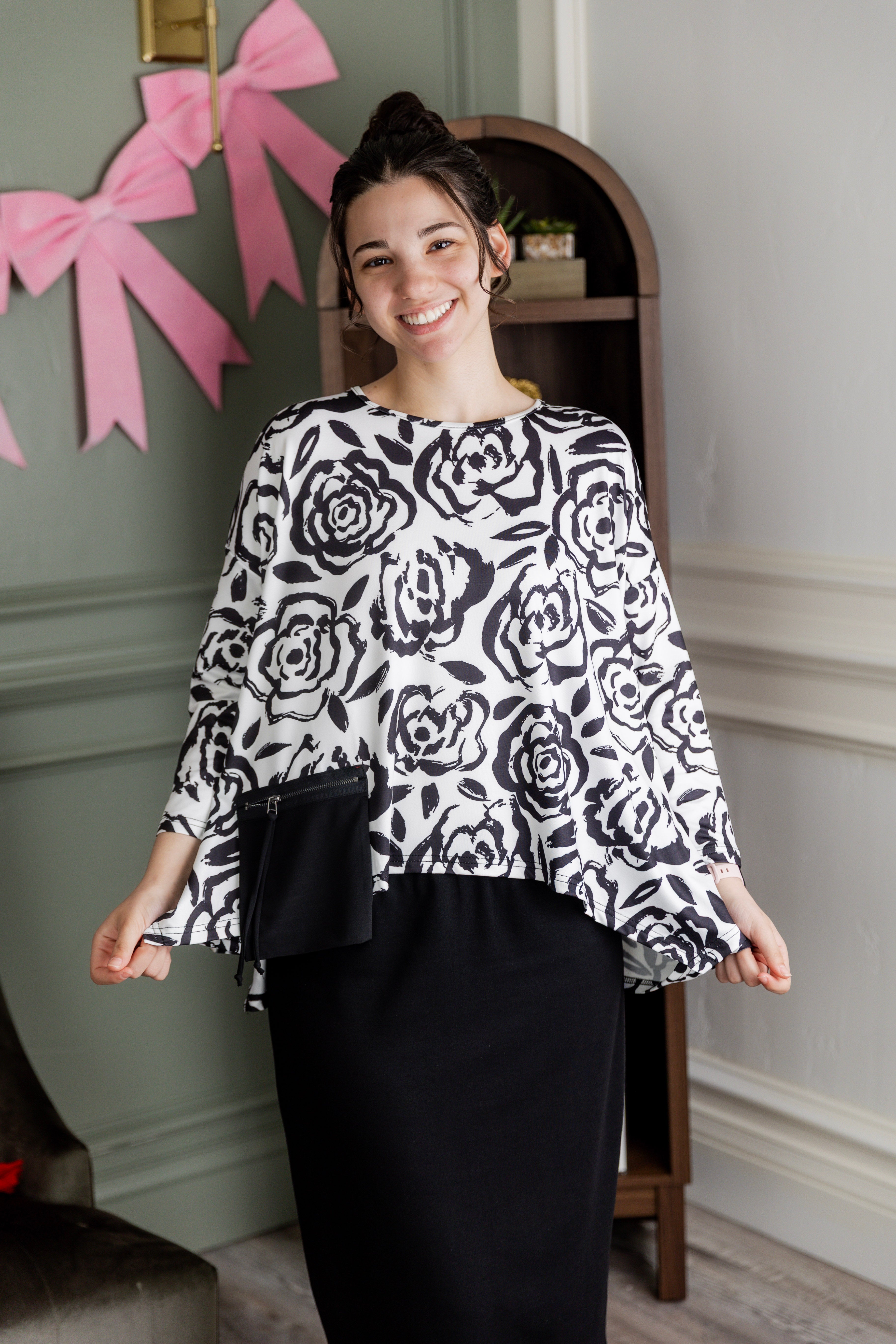 Model wearing the Nuggles® Keegan Top in Midnight Rose print modest boutique top