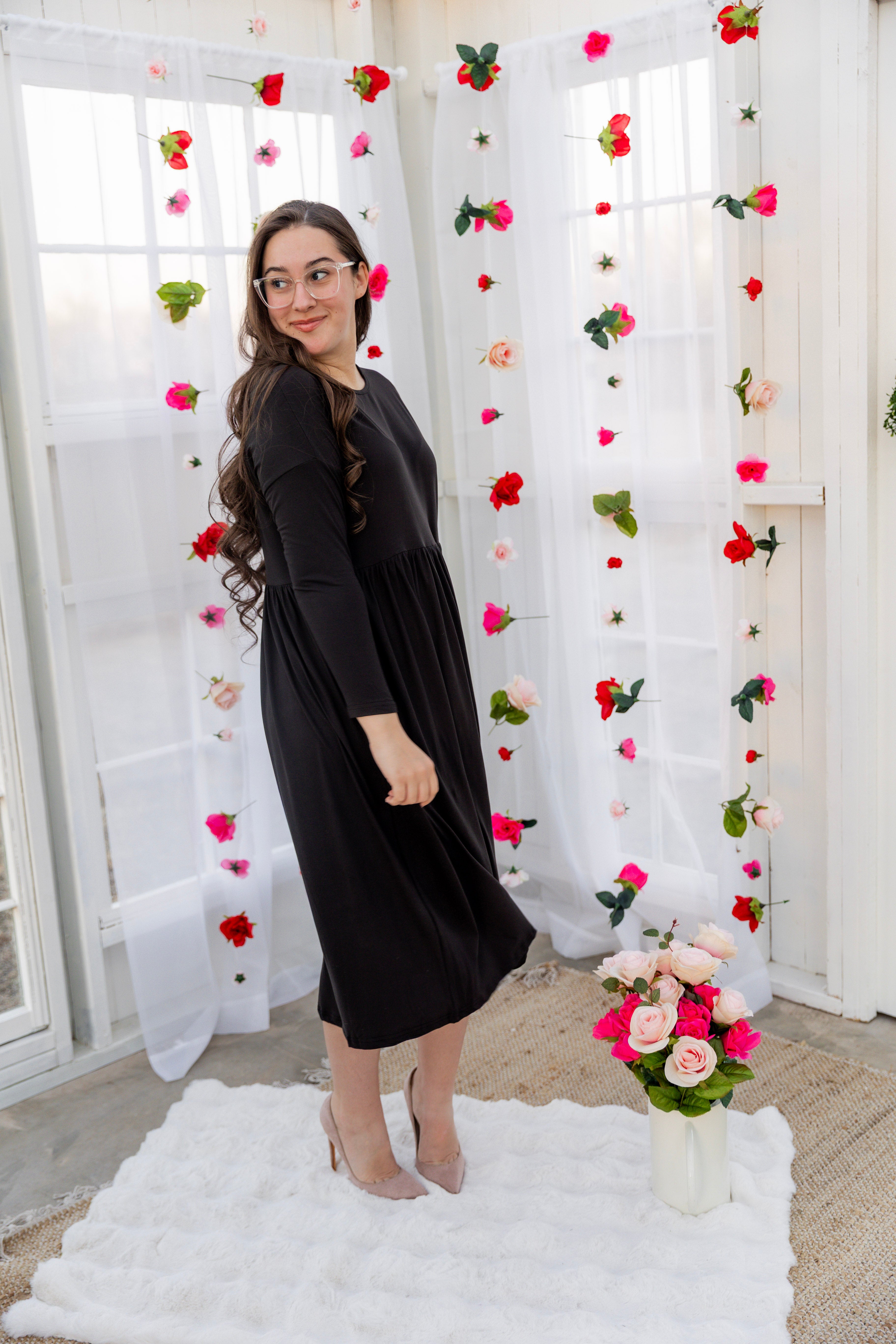 Model wearing the Nuggles® Farah Dress in Black