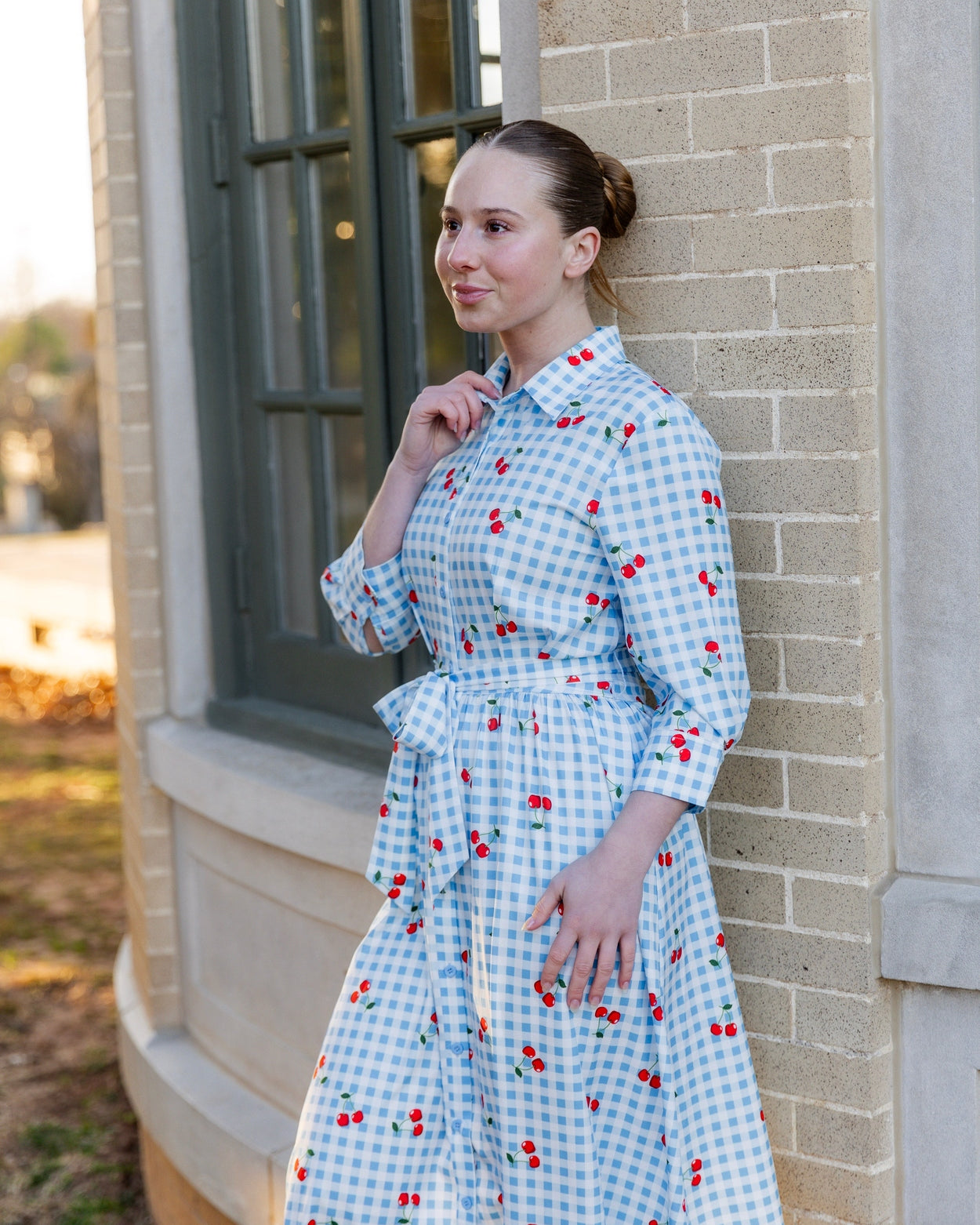 Model wearing the Nuggles® Rachel Dress in Sweet Cherry Check