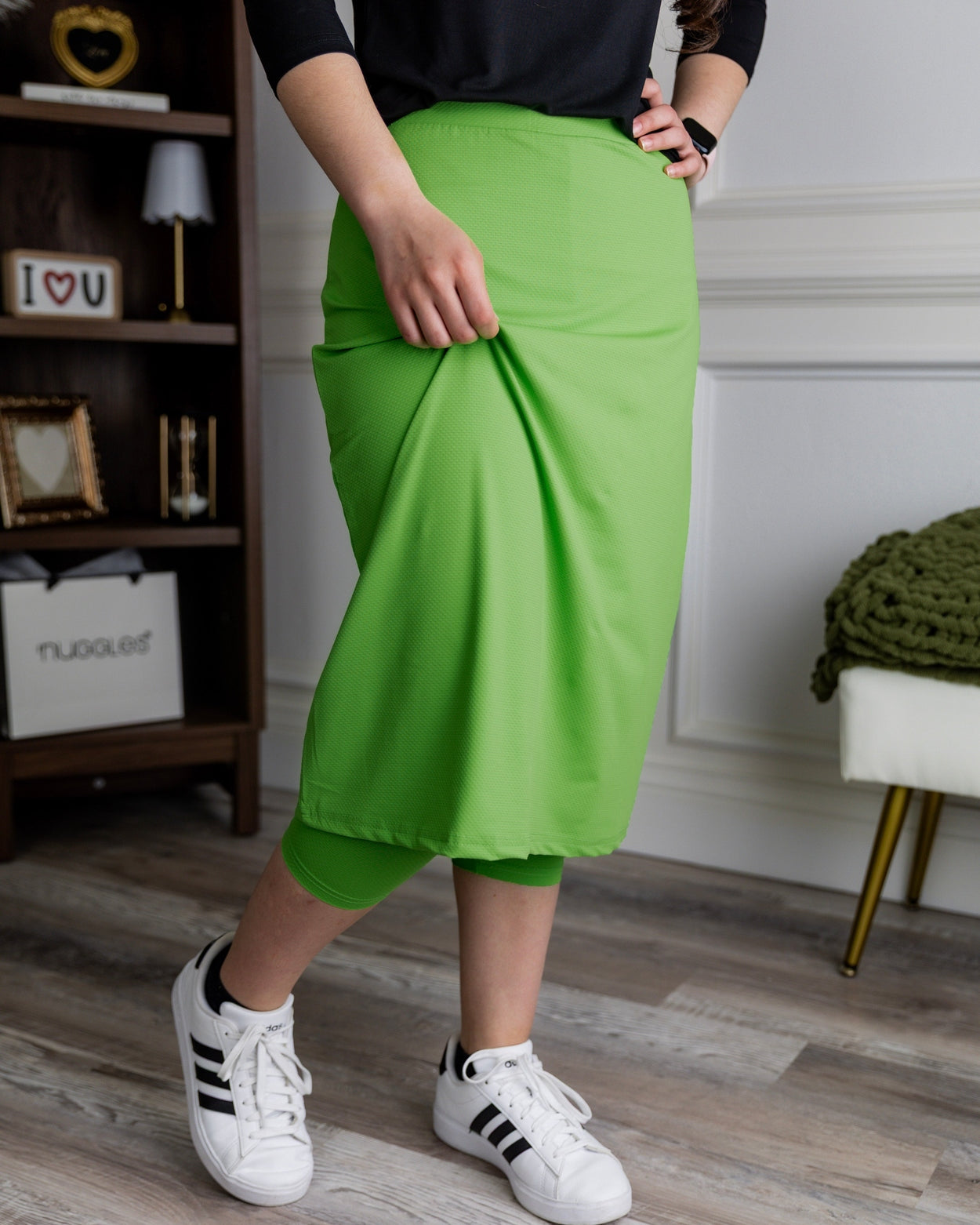 Model wearing Nuggles® 27" All-Sport Skirt in Green