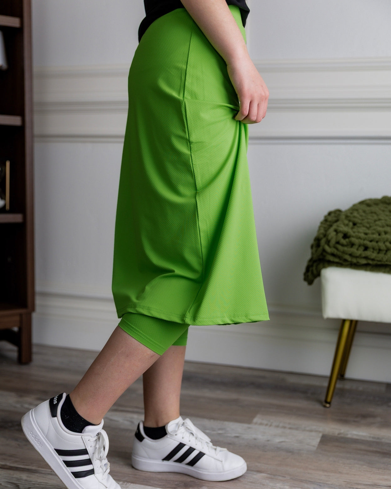 Model wearing Nuggles® 27" All-Sport Skirt in Green