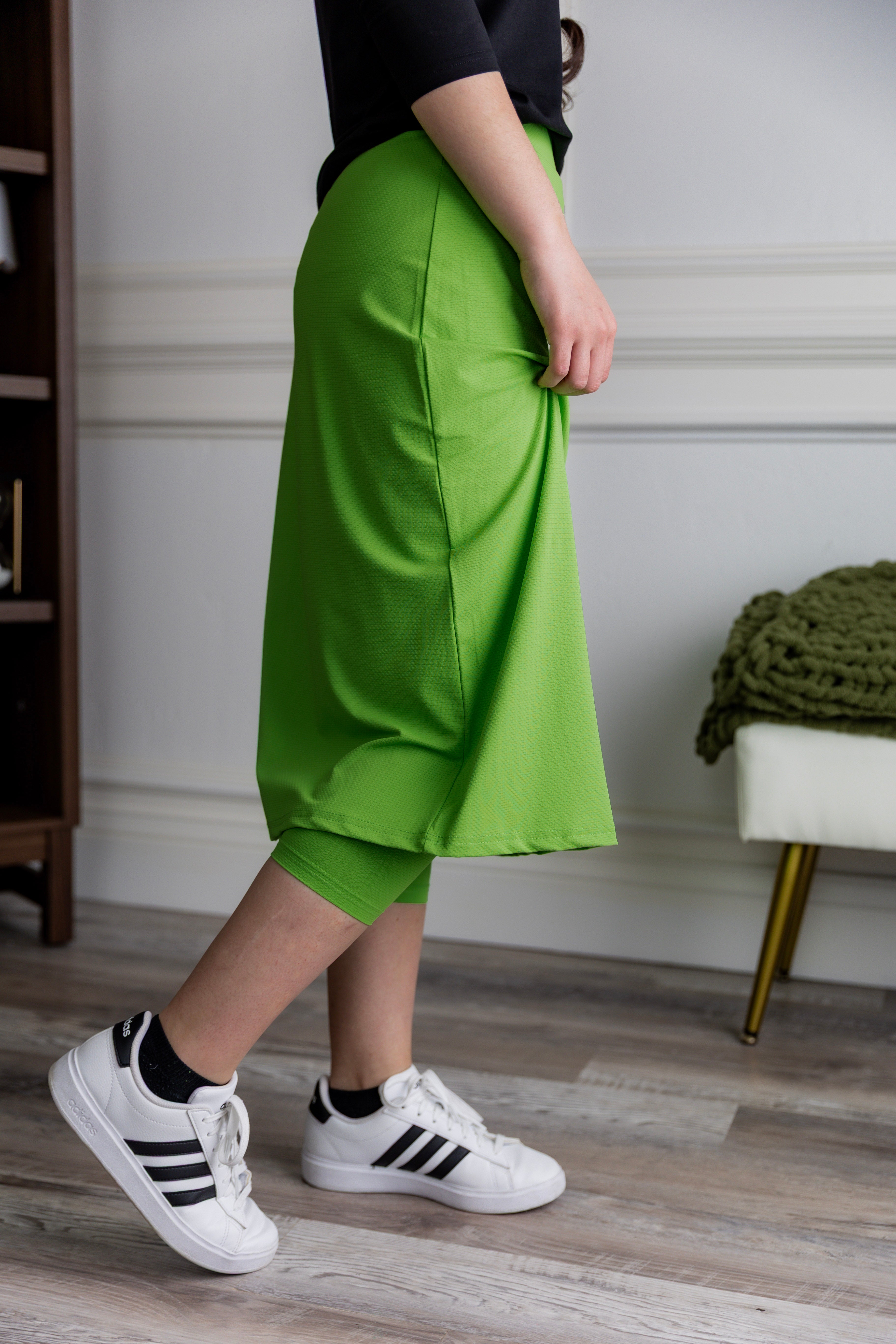 Model wearing Nuggles® 27" All-Sport Skirt in Green