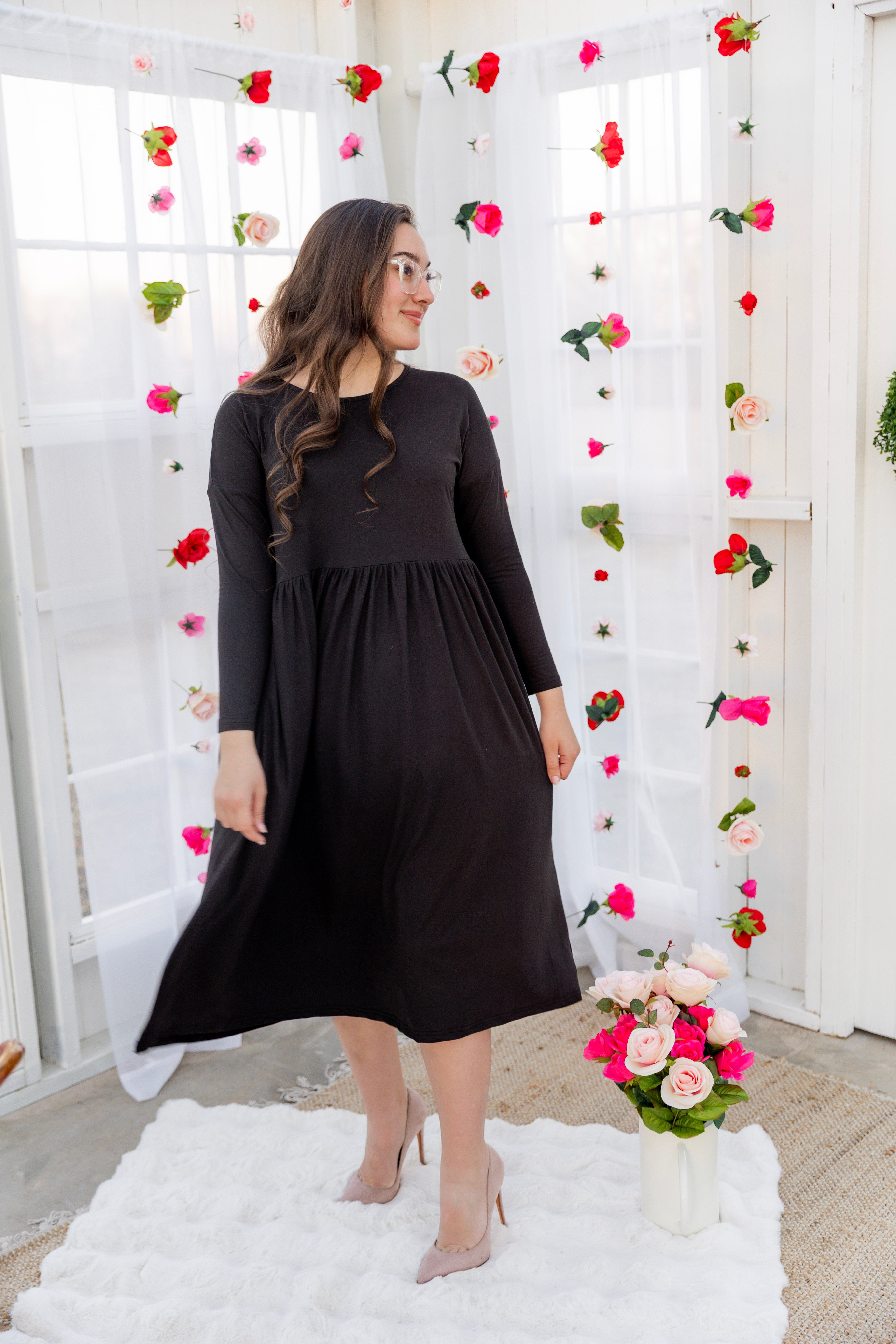 Model wearing the Nuggles® Farah Dress in Black