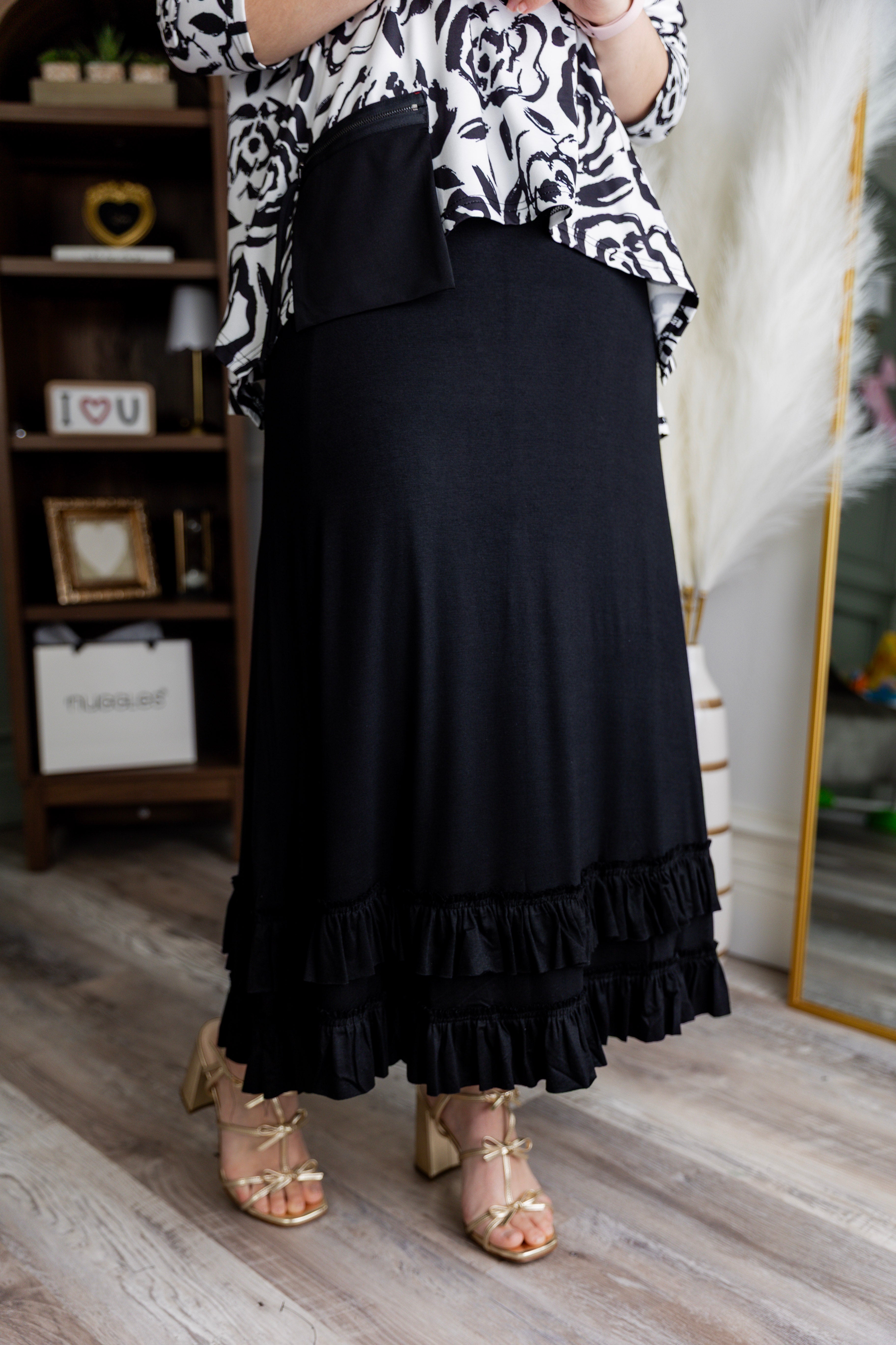 Model wearing Nuggles® Callie Skirt in Black modest skirt