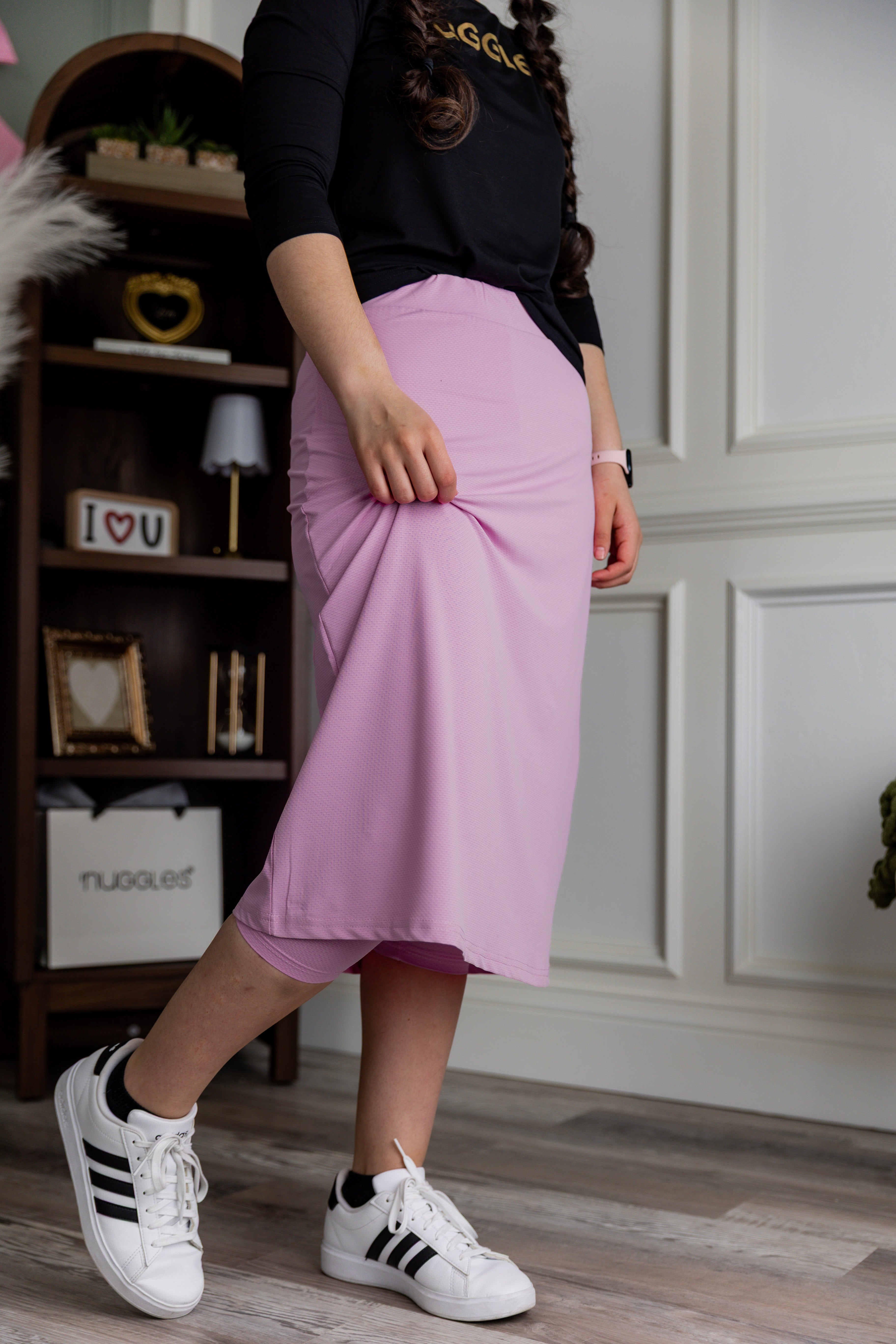 Model wearing Nuggles® 27" All-Sport Skirt in Pink