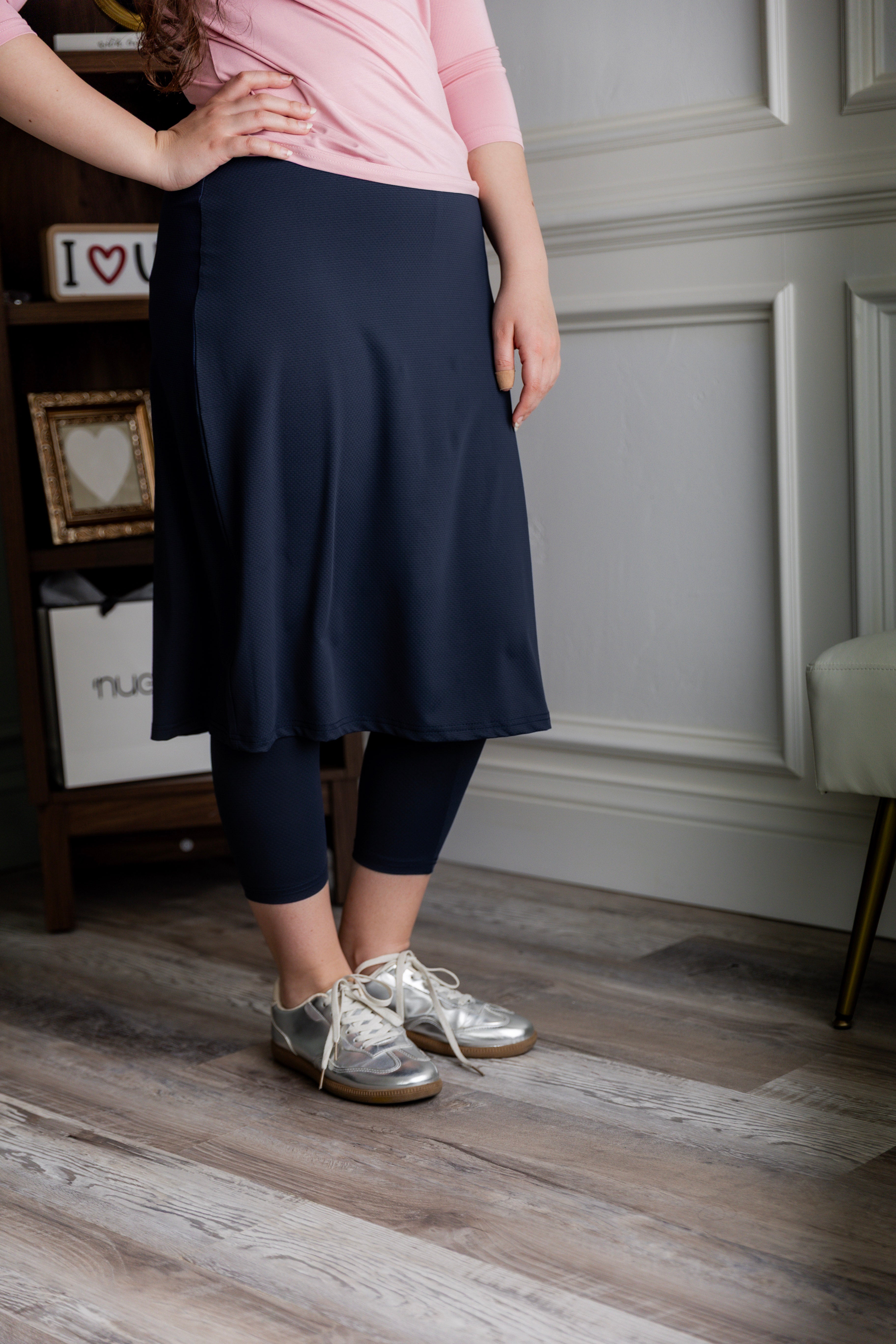 Model wearing Nuggles® 27" All-Sport Skirt in Navy