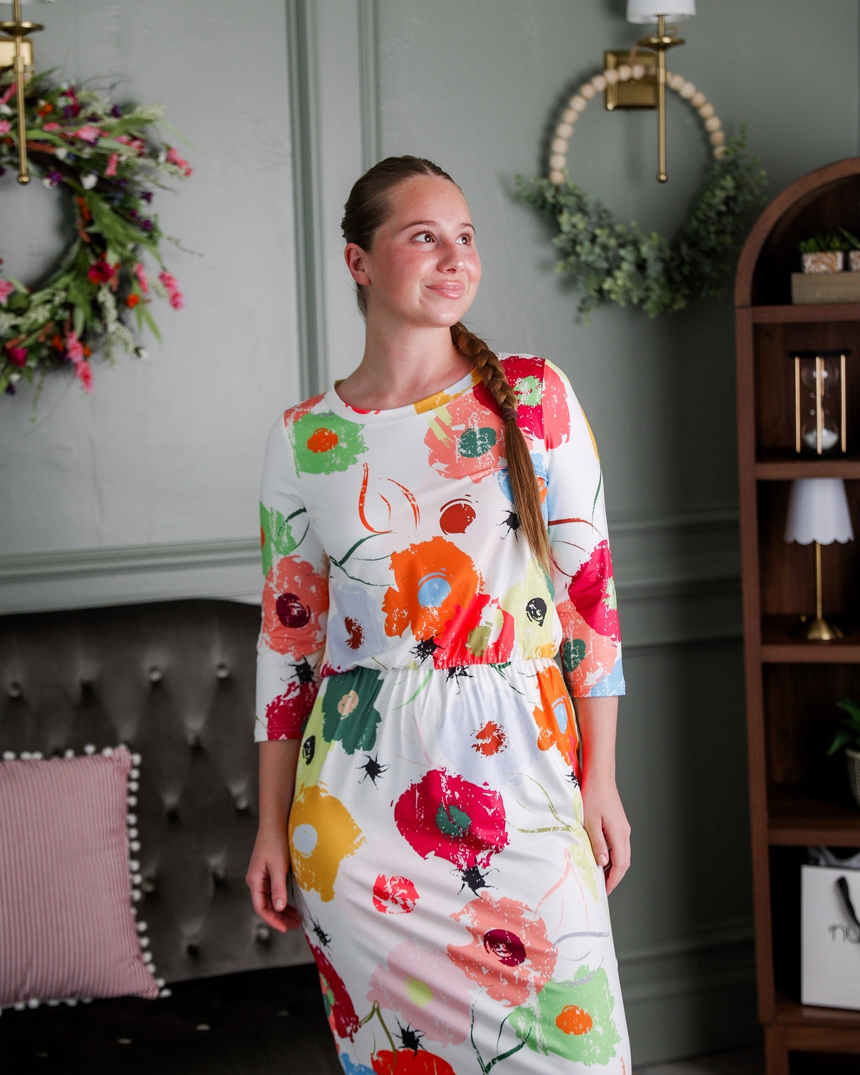 Model wearing Nuggles® Harper Jane Dress in Party Blooms
