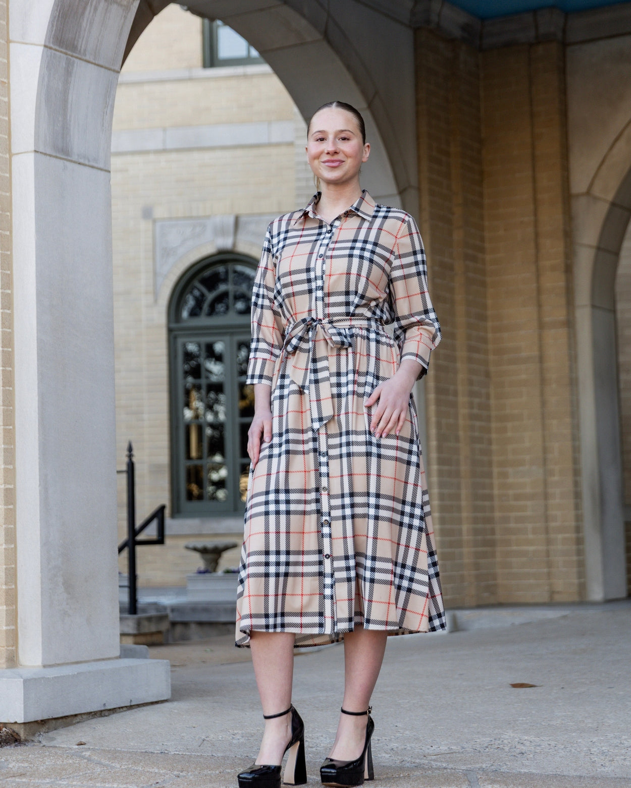Model wearing the Nuggles® Rachel Dress in Sand Plaid