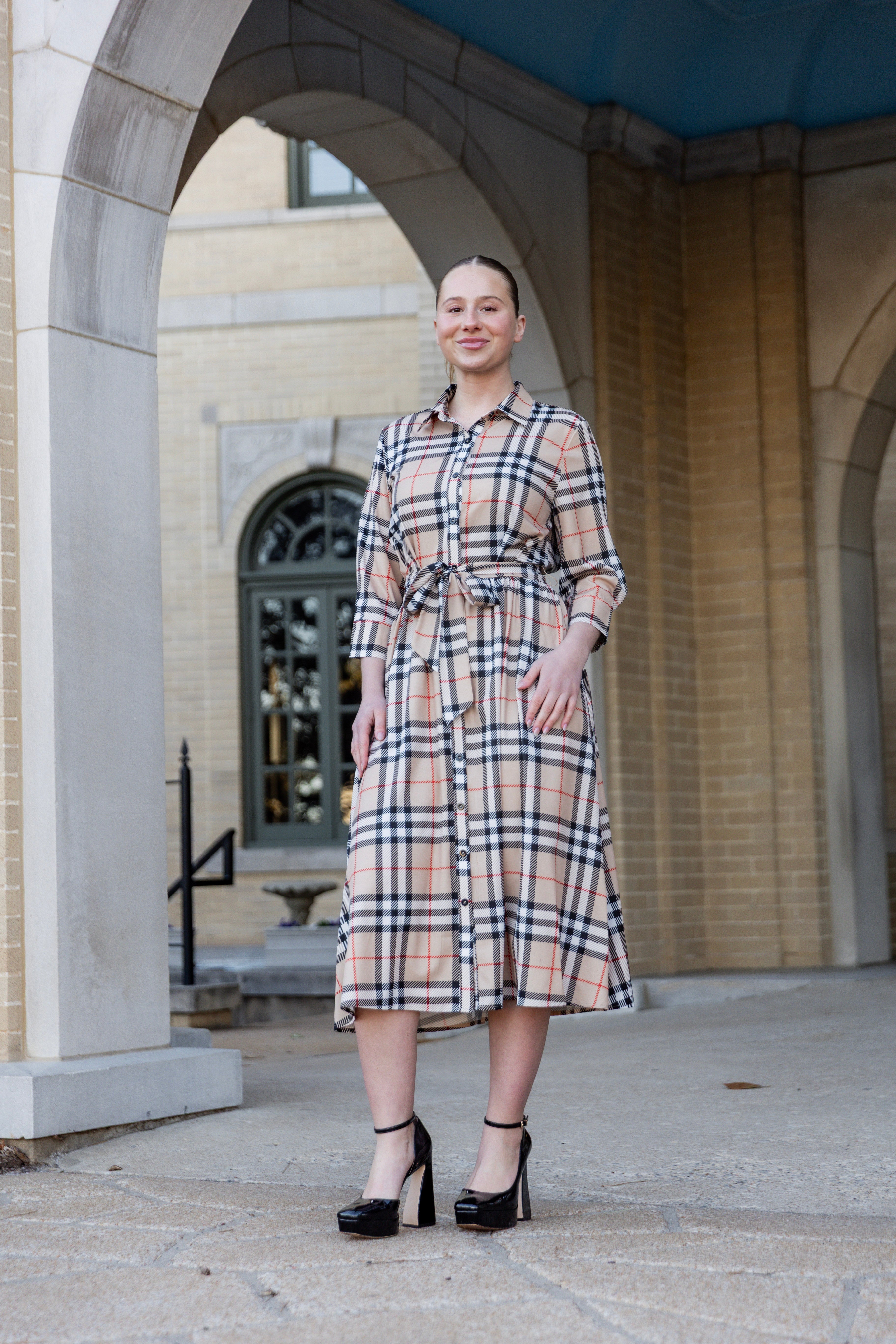 Model wearing the Nuggles® Rachel Dress in Sand Plaid