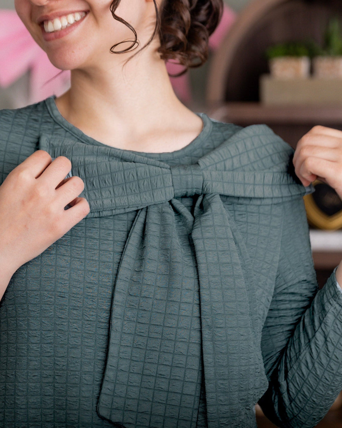 Model wearing Nuggles® Eleanor Top in Green