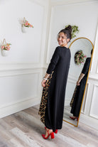 Model modeling Nuggles® Charay Dress with ¾ sleeves and high-low hem. Modest and stylish A-line dress with flattering fit.