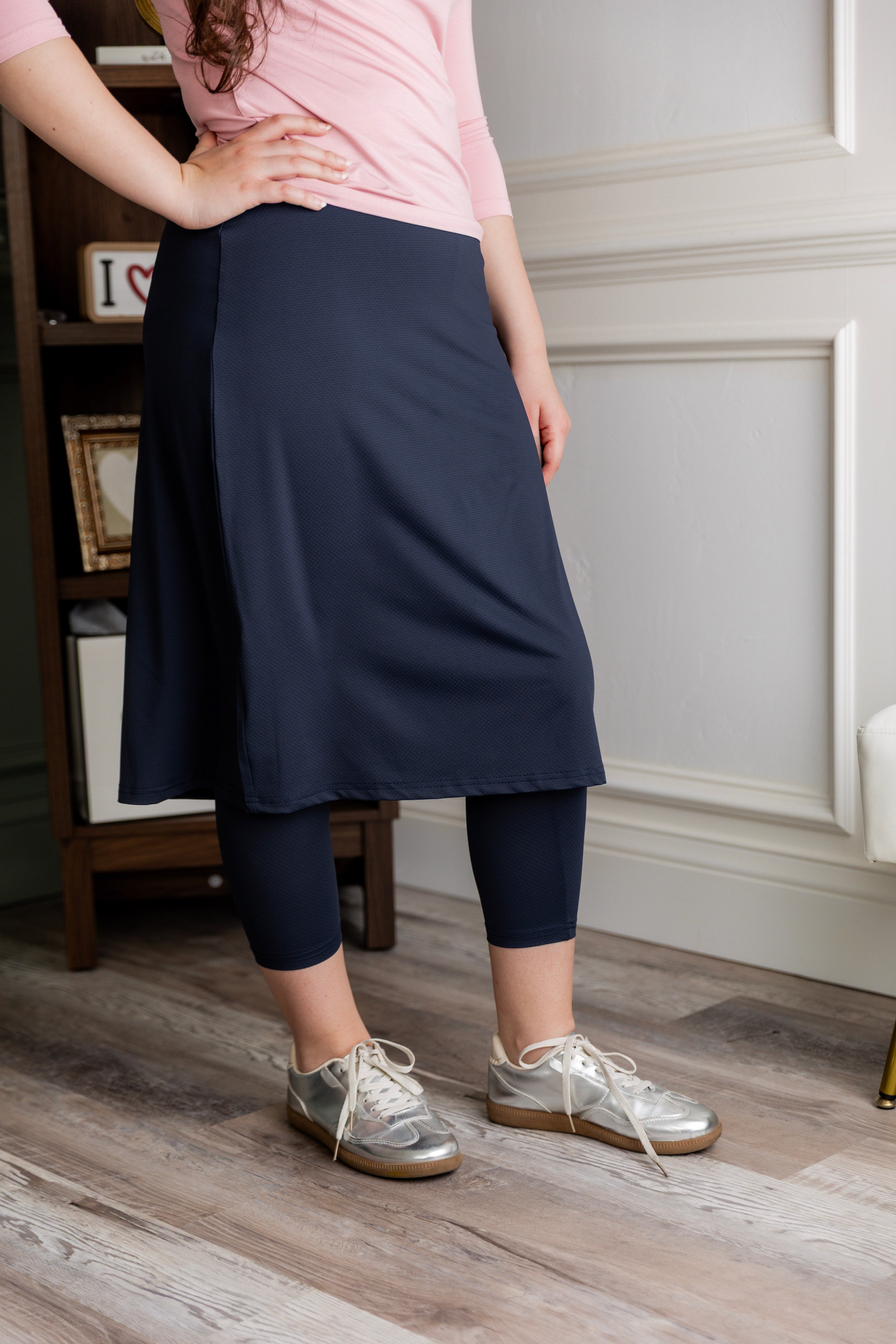 Model wearing Nuggles® 27" All-Sport Skirt in Navy