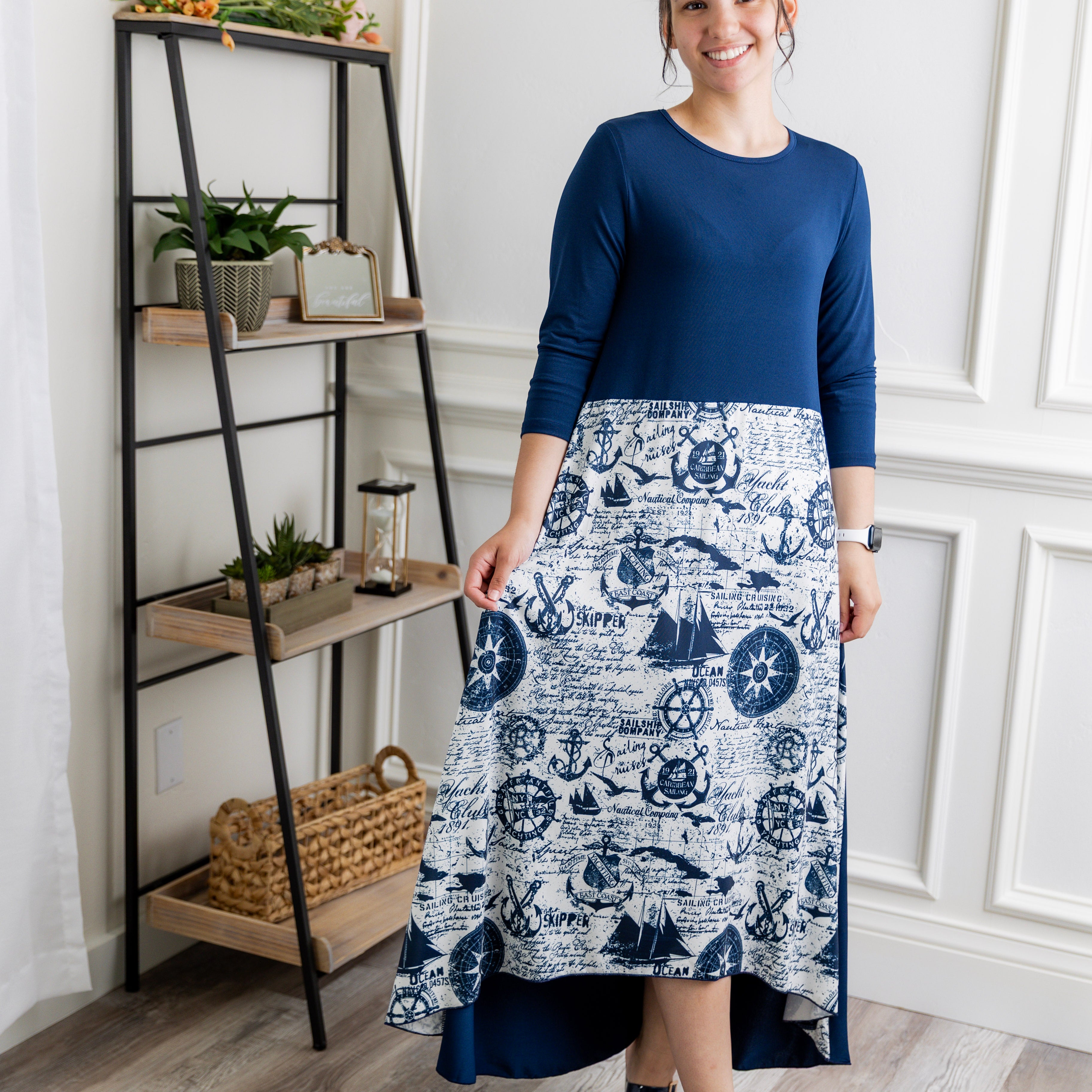 Model modeling Nuggles® Charay Dress with ¾ sleeves and high-low hem. Modest and stylish A-line dress with flattering fit.